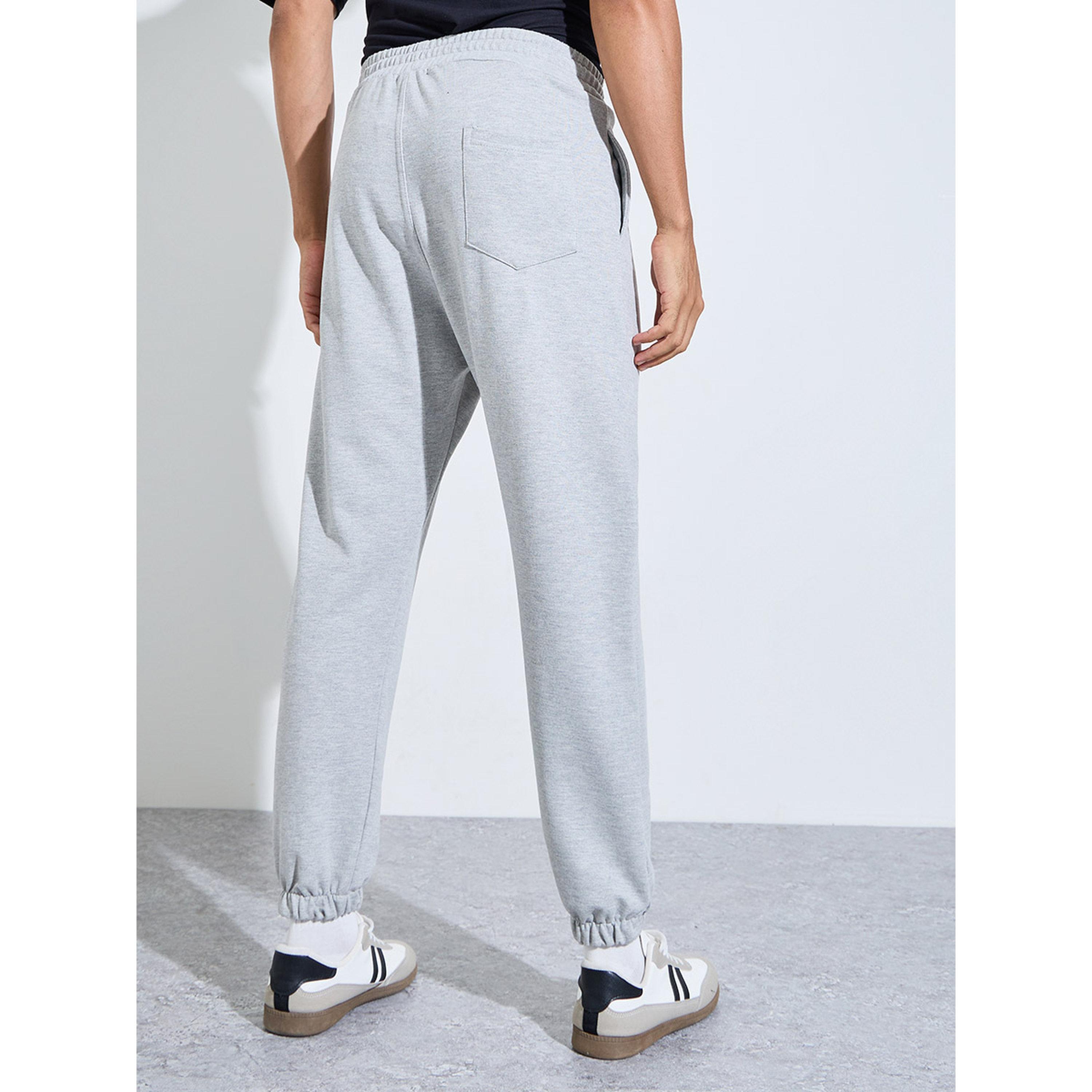 جوغر واسع بتفاصيل جيوب وطبعة شعار-men-clothing-joggers-image-4