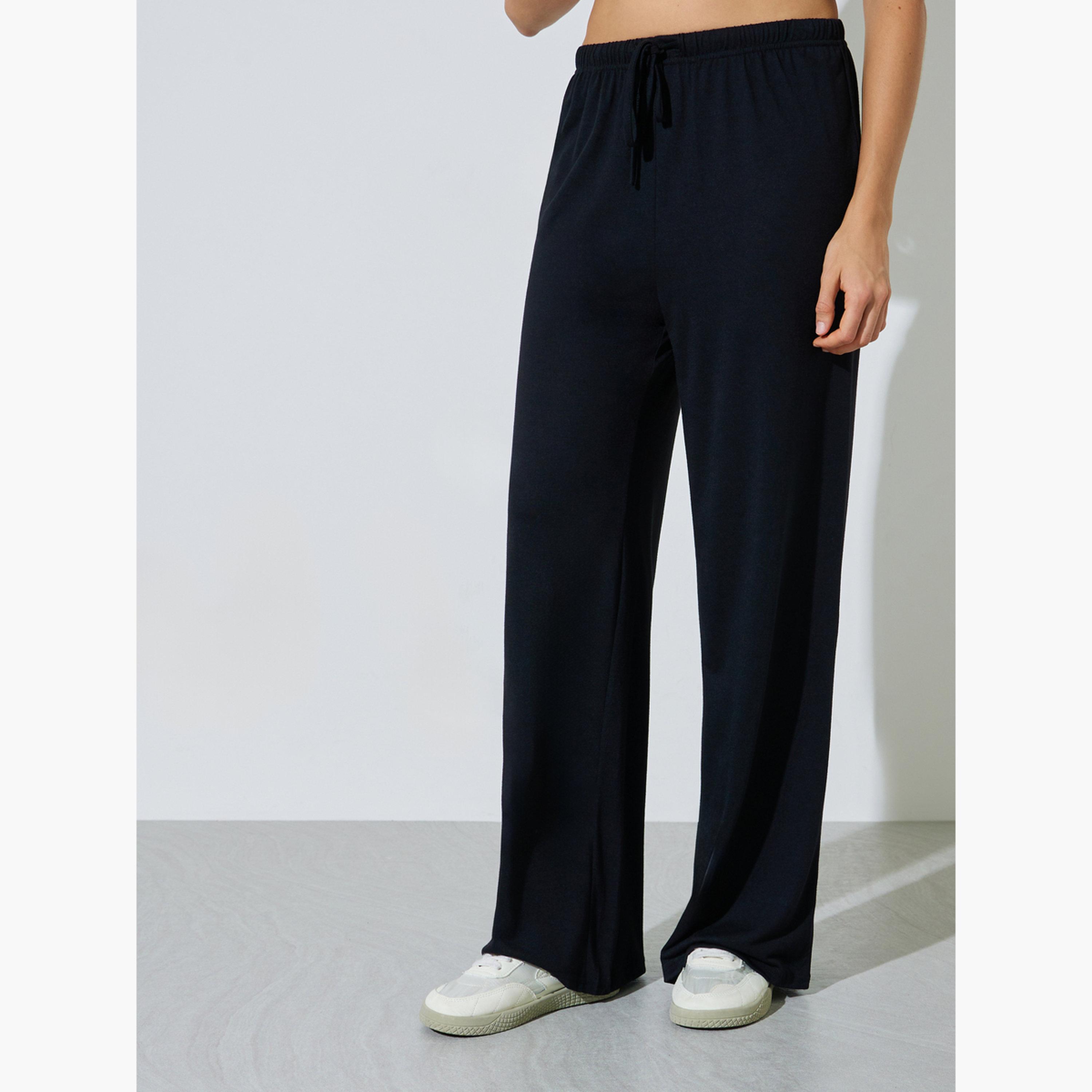 طقم منسق من جوغر بأرجل واسعة وبلوزة واسعة سادة-women-clothing-coordsets-image-5