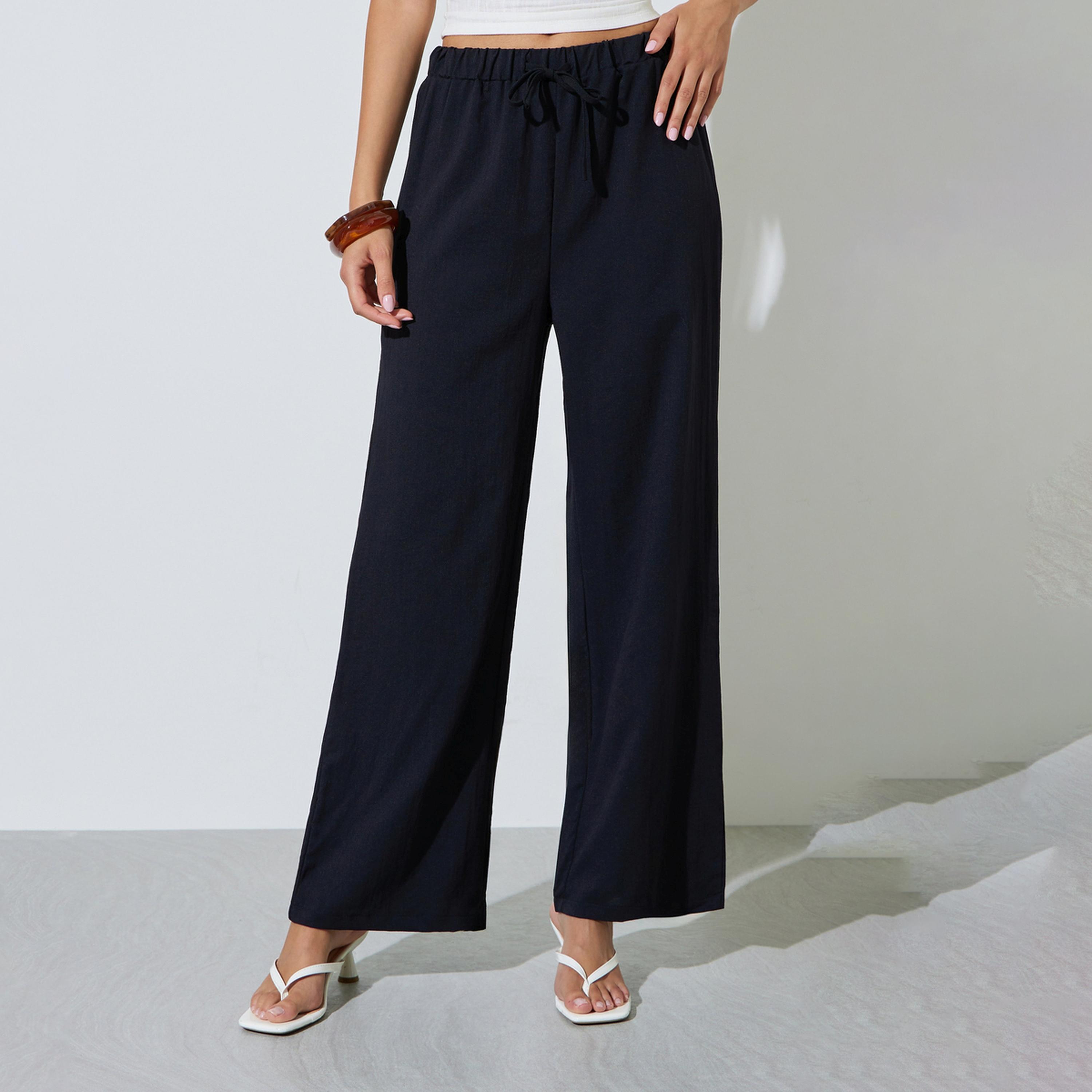 بنطال بأرجل واسعة وخصر مرن سادة-women-clothing-trousers-image-1
