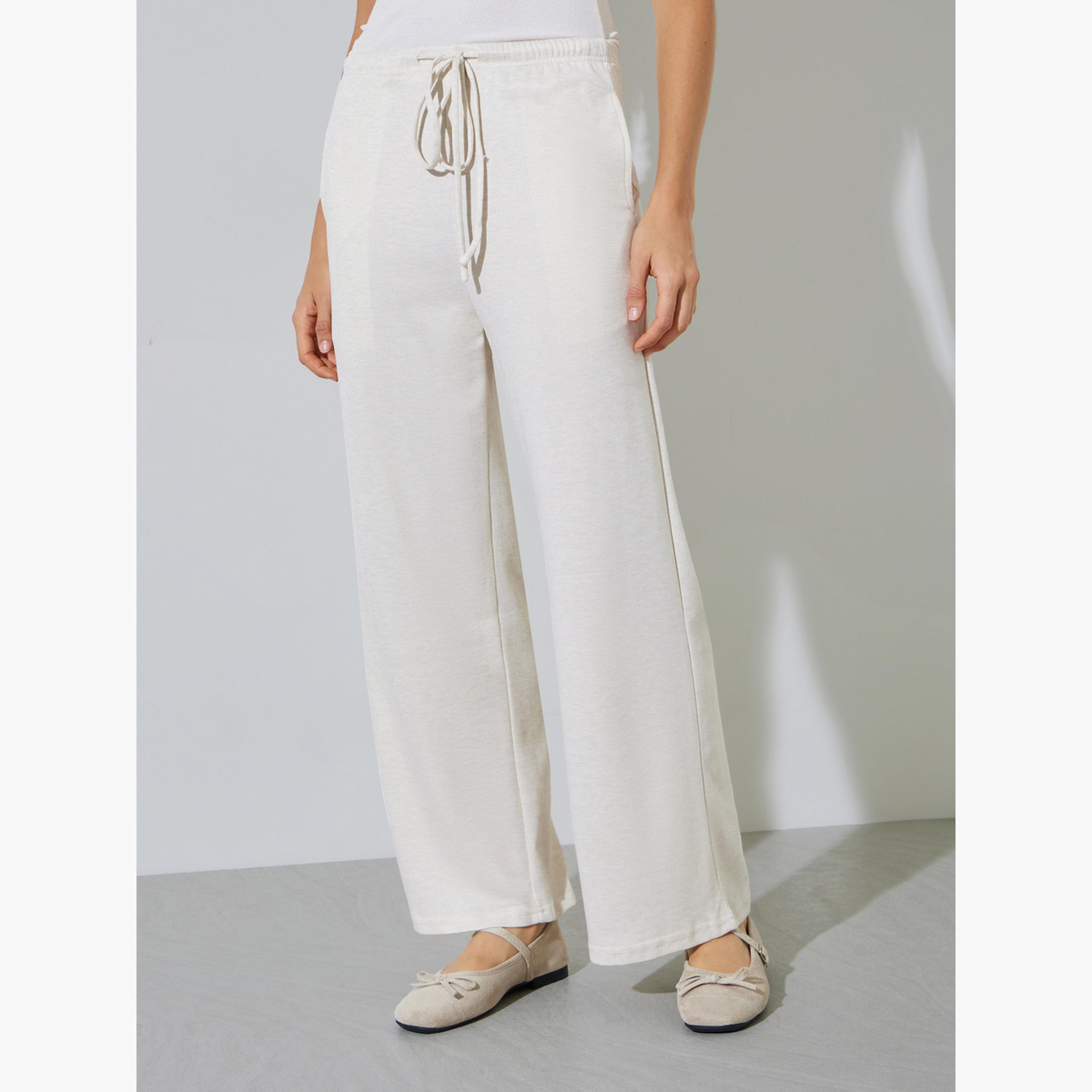 ستايلي - بنطال واسع الساقين بلون أبيض كريمي مع جيب جانبي-women-clothing-bottoms-joggers-image-1