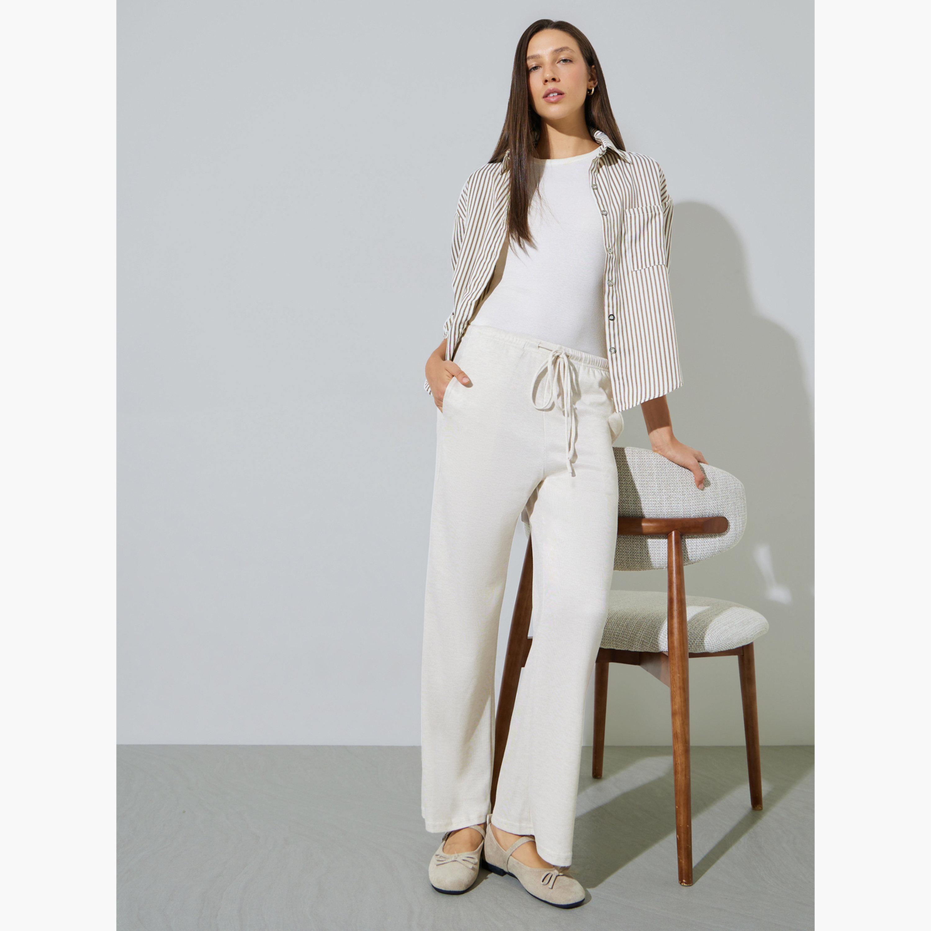 ستايلي - بنطال واسع الساقين بلون أبيض كريمي مع جيب جانبي-women-clothing-bottoms-joggers-image-2