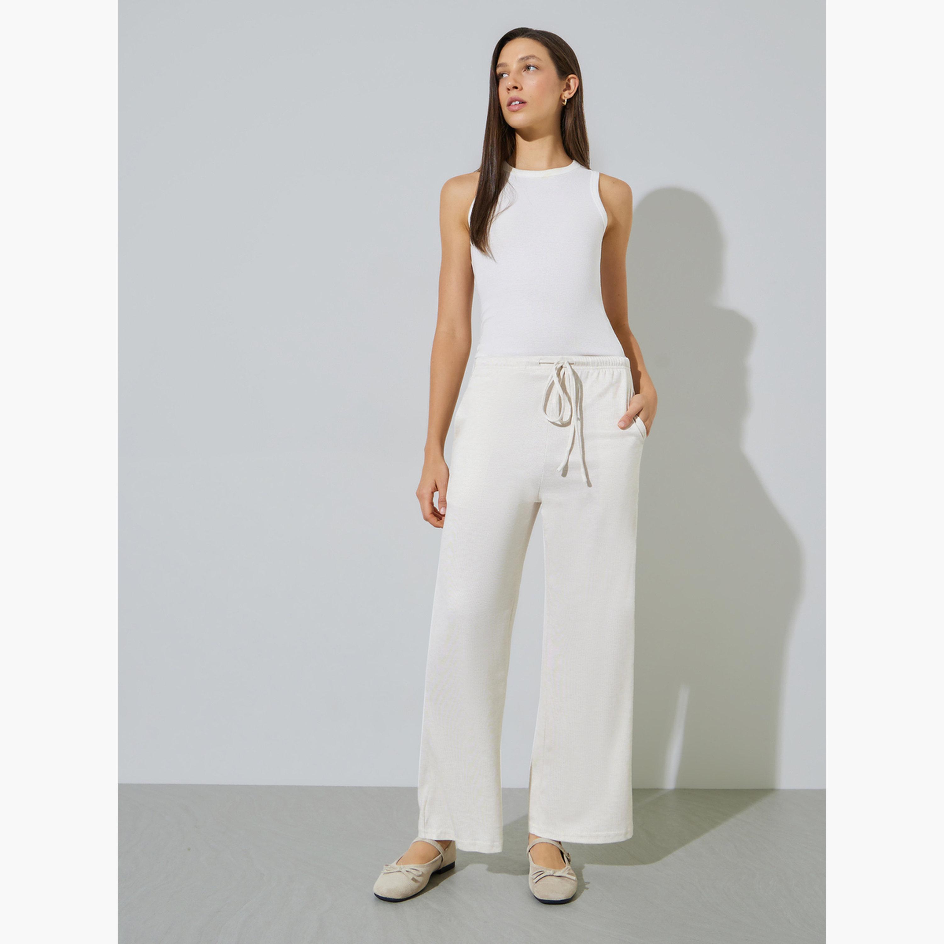 ستايلي - بنطال واسع الساقين بلون أبيض كريمي مع جيب جانبي-women-clothing-bottoms-joggers-image-3