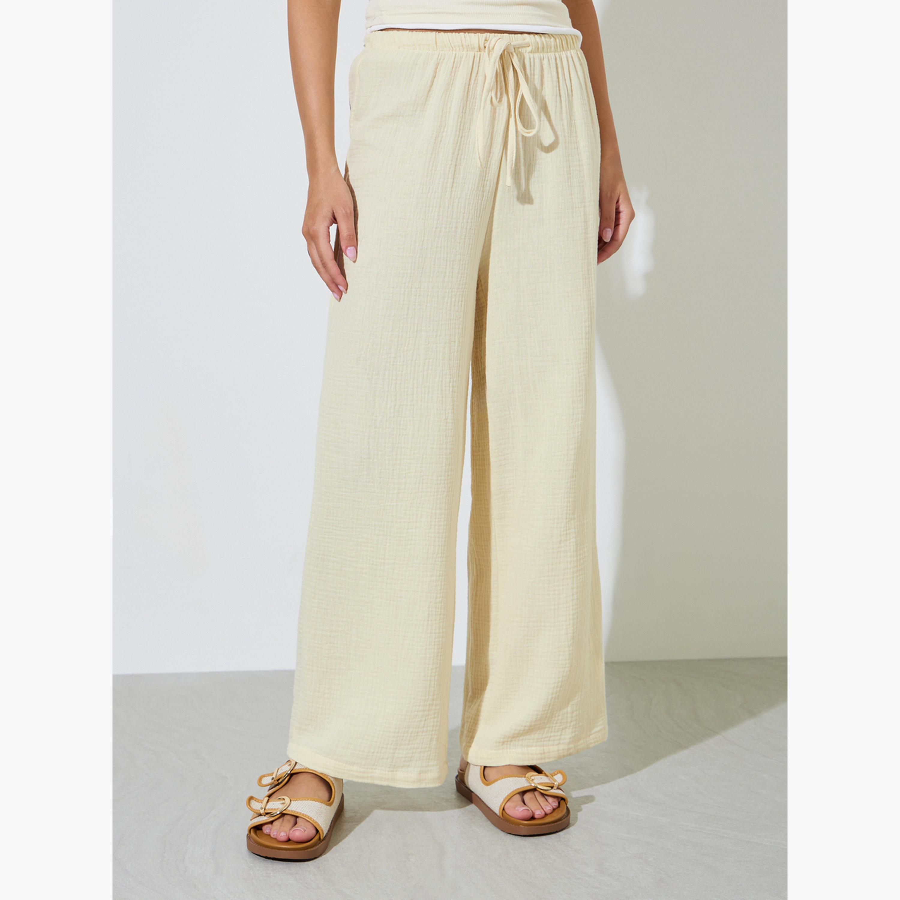 بنطال قطن بأرجل واسعة ورباط بيج-women-clothing-trousers-image-1