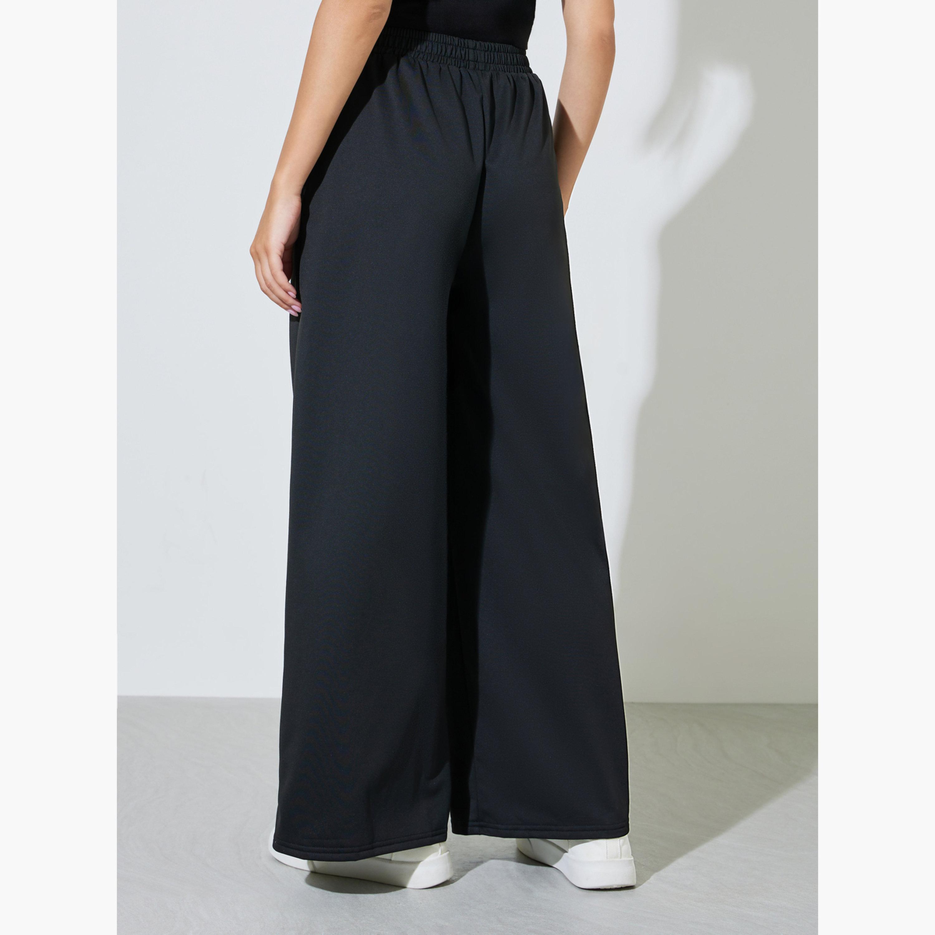 بنطال بأرجل واسعة مع حزام خصر مطاطي-women-clothing-trousers-image-4