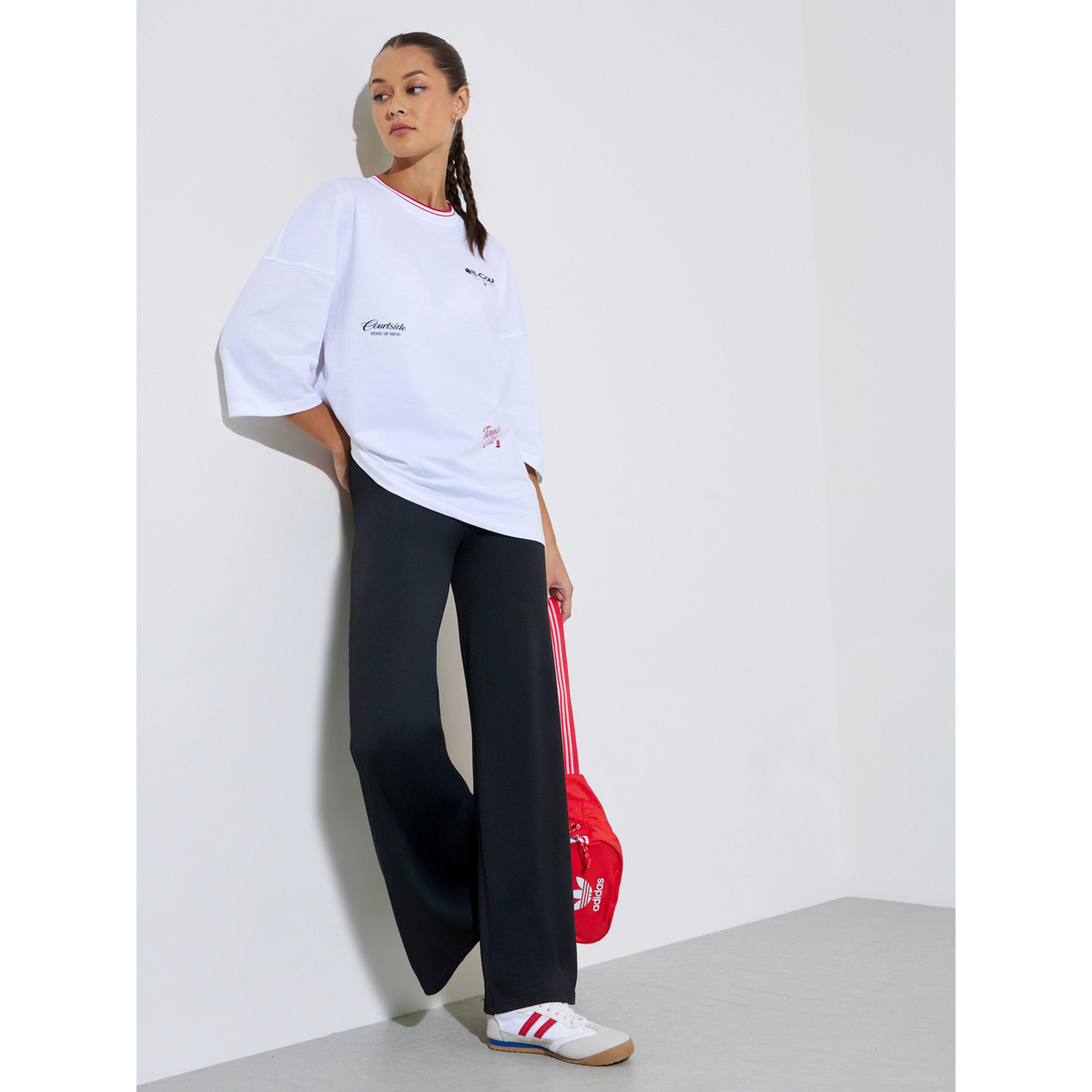 بنطال بأرجل عريضة أسود سادة-women-clothing-joggers-image-2