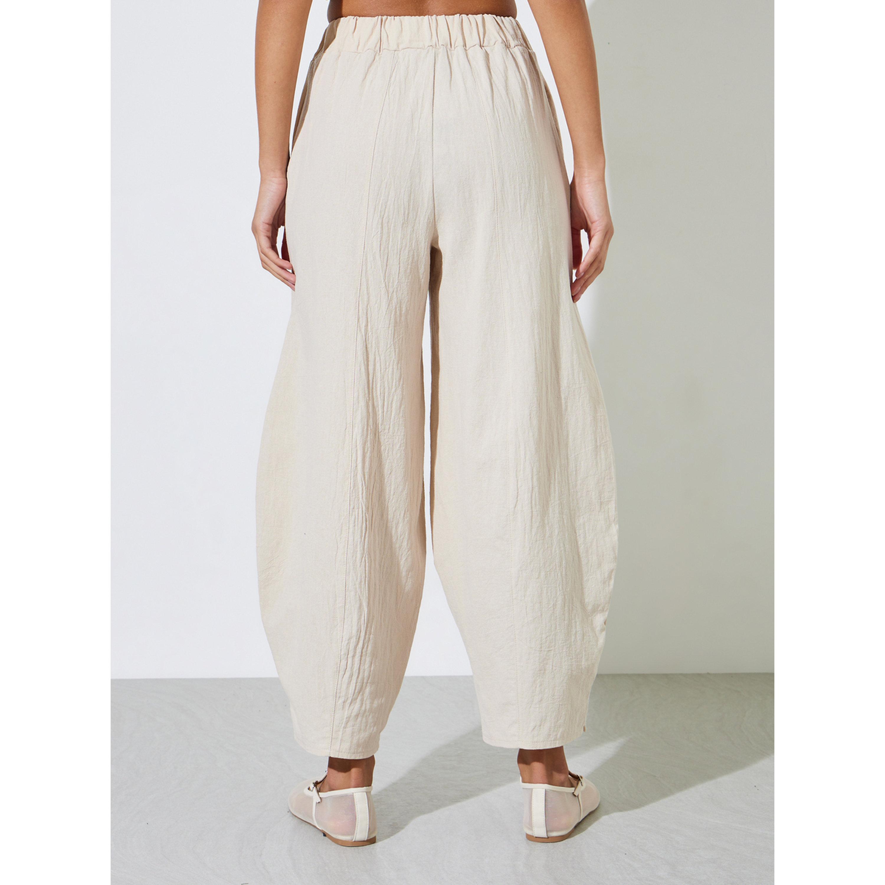 Styli Beige Textured Wide Leg Pleated Tapered Pants-women-clothing-joggers-image-3