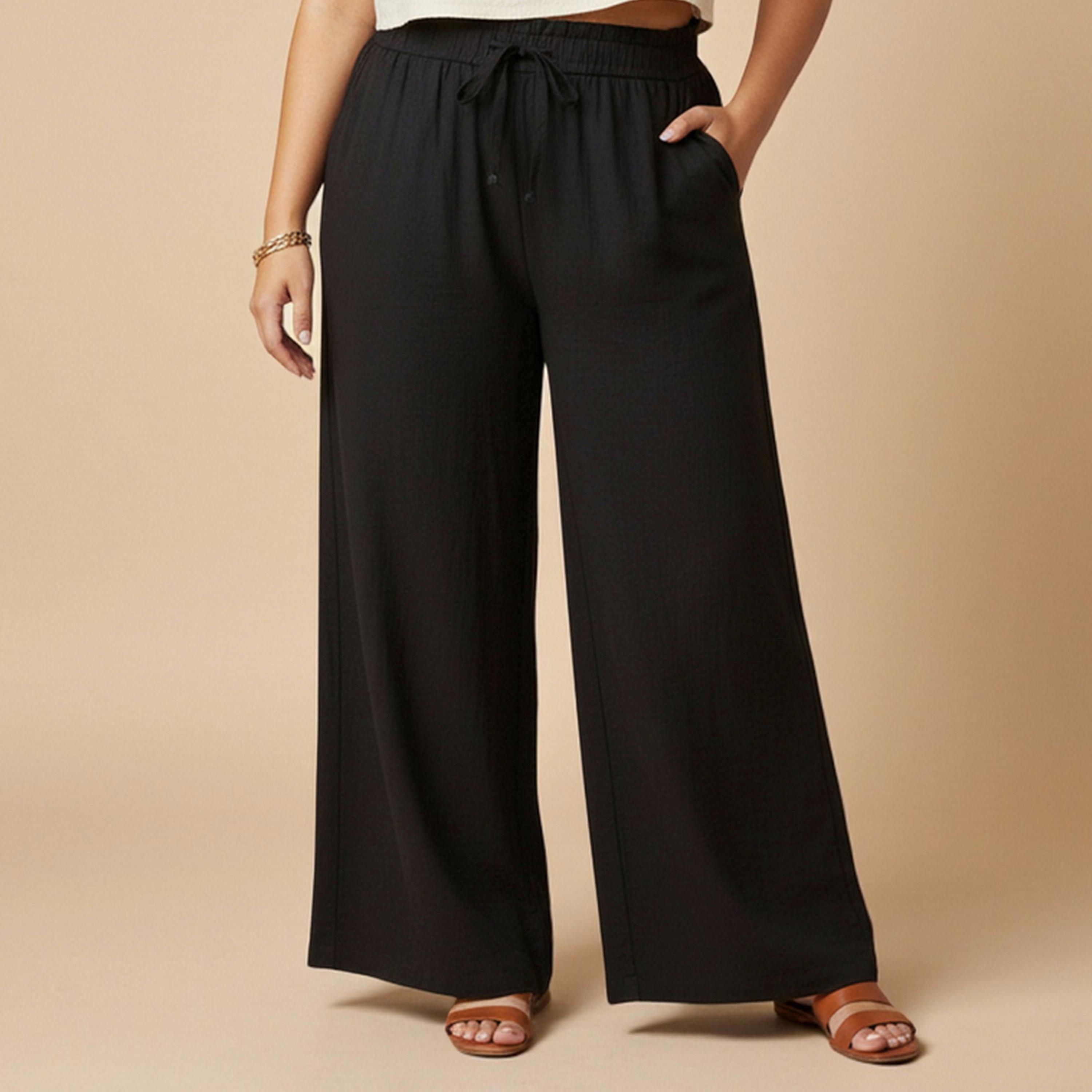 بنطال مقاس كبير بأرجل واسعة ورباط خصر باللون الأسود-women-clothing-joggers-image-1