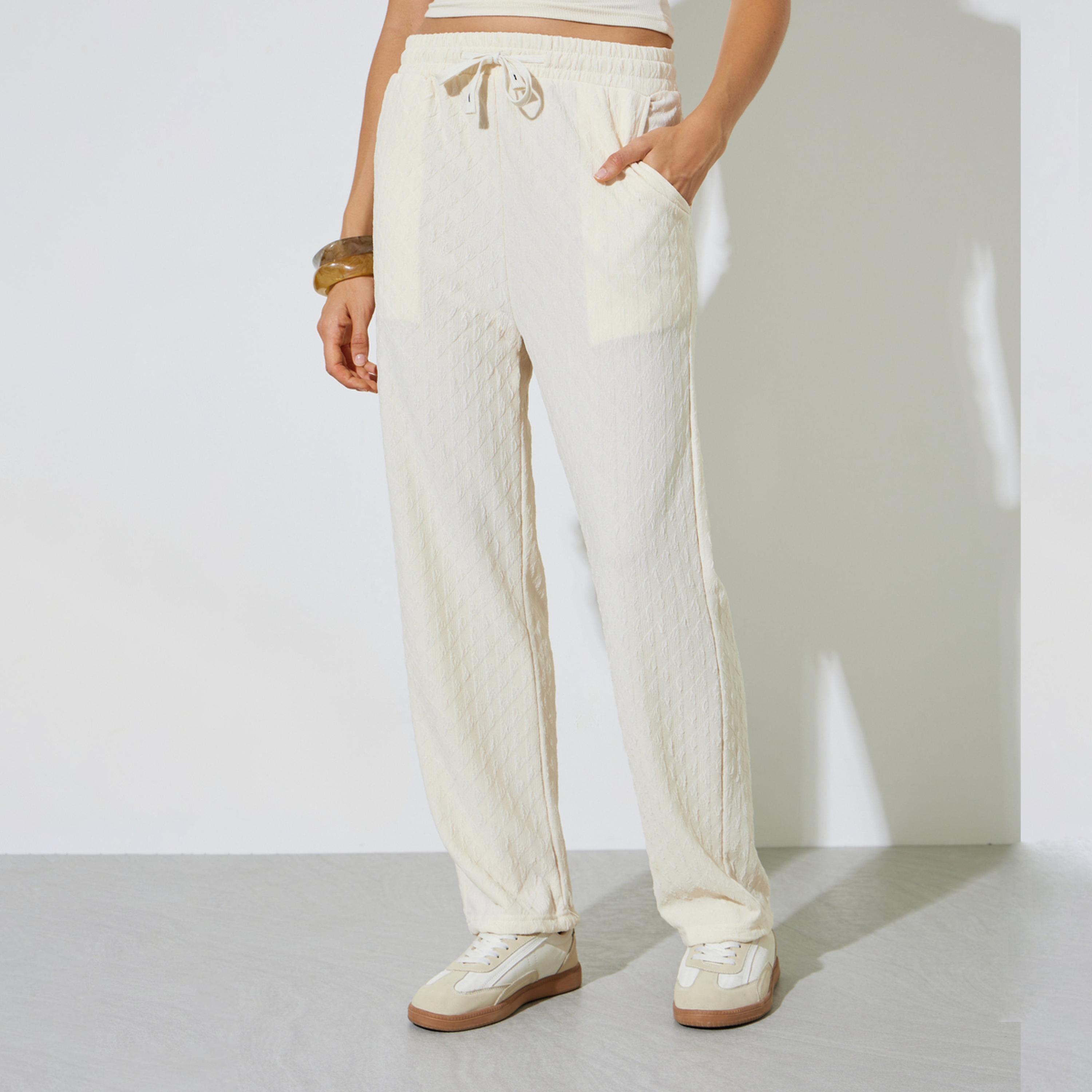 ستايلي - بنطال رياضي واسع الساقين بلون بيج محكم النقش برباط-women-clothing-bottoms-joggers-image-1