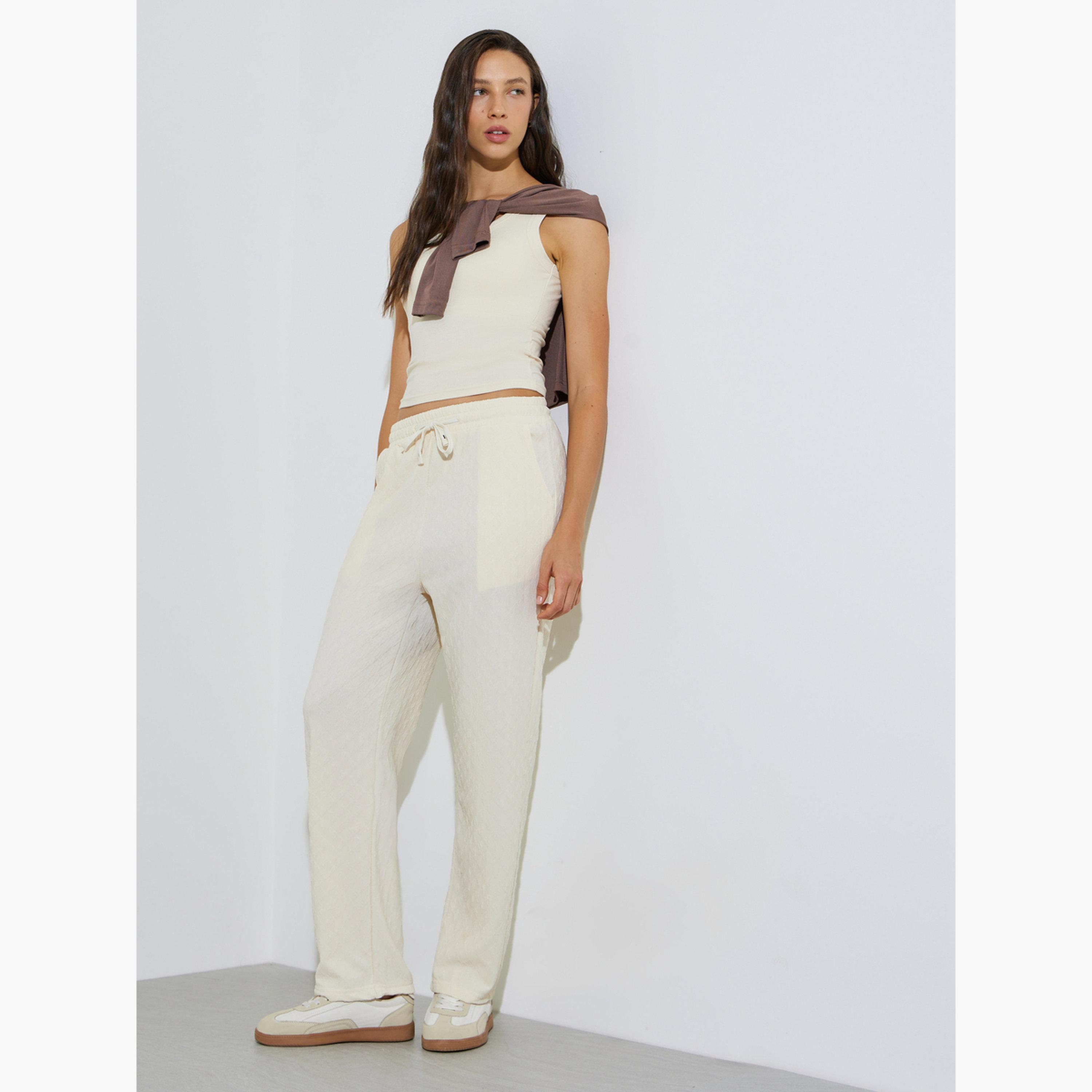 ستايلي - بنطال رياضي واسع الساقين بلون بيج محكم النقش برباط-women-clothing-bottoms-joggers-image-2