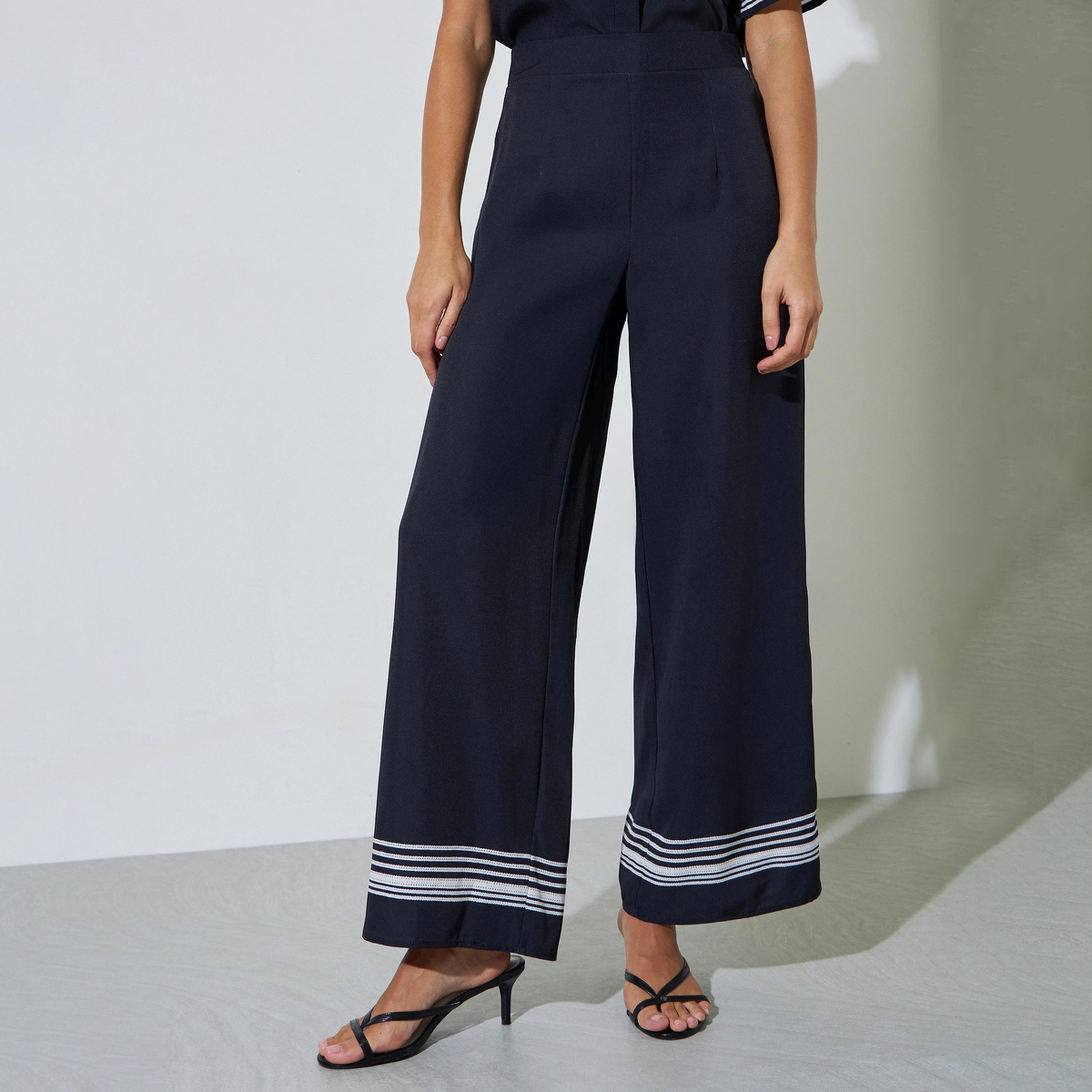 بنطال بأرجل واسعة وحافة مخطط لون أسود-women-clothing-bottoms-joggers-image-1