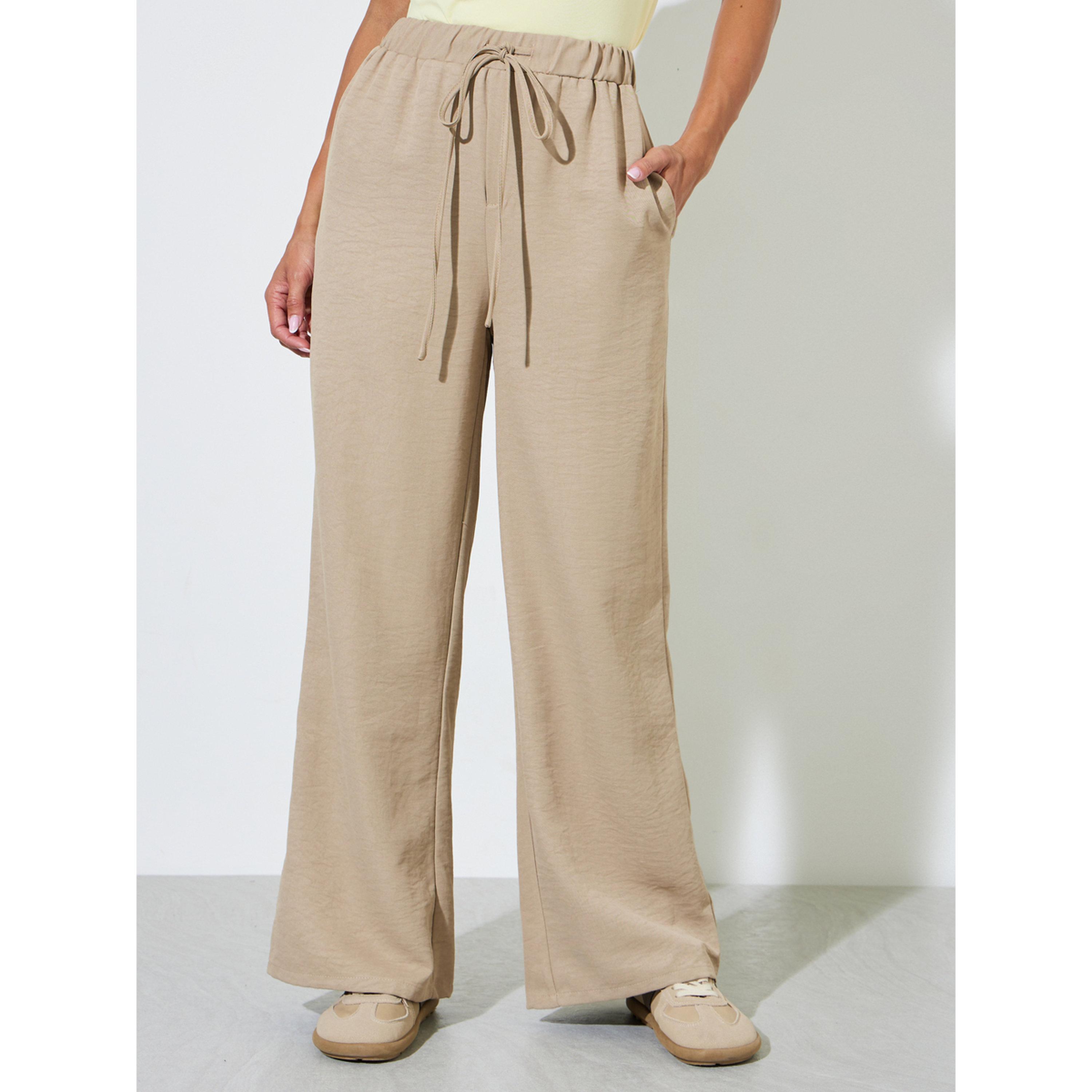 Styli Beige Solid Wide Leg Drawstring Trousers-women-clothing-joggers-image-1