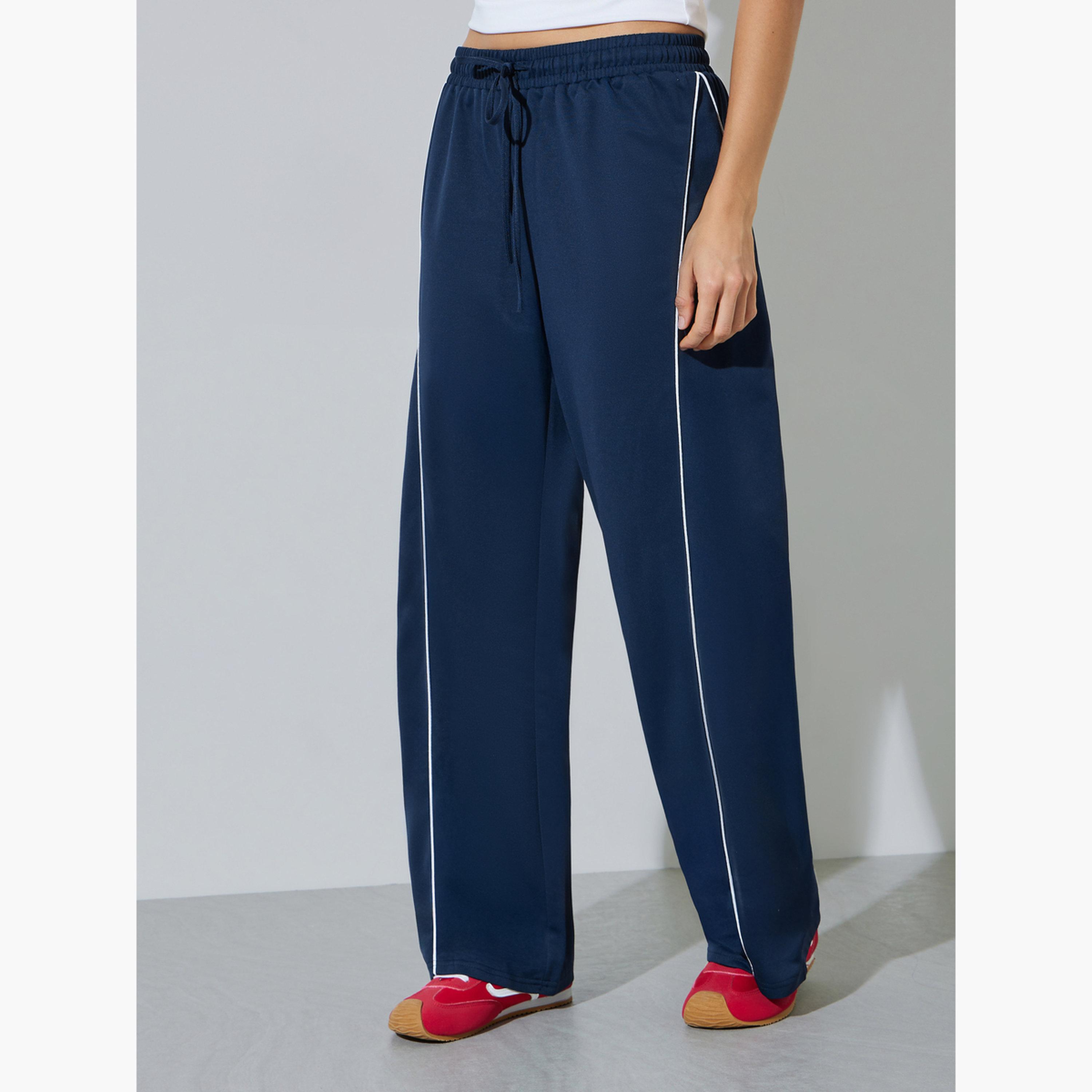 ستايلي - بنطال رياضي واسع الساقين بلون أزرق داكن مع خط جانبي-women-clothing-bottoms-joggers-image-1
