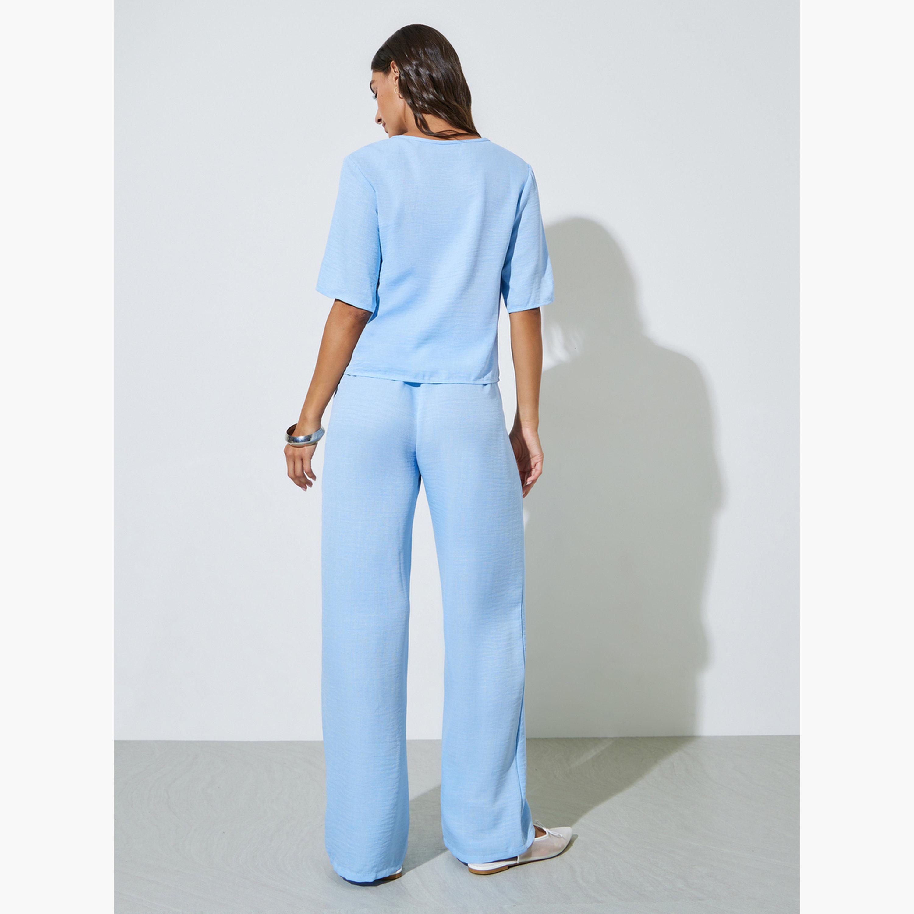 طقم منسق من بنطال بأرجل واسعة وبلوزة برباط عنق بلون سادة لون أزرق-women-clothing-coordsets-image-4
