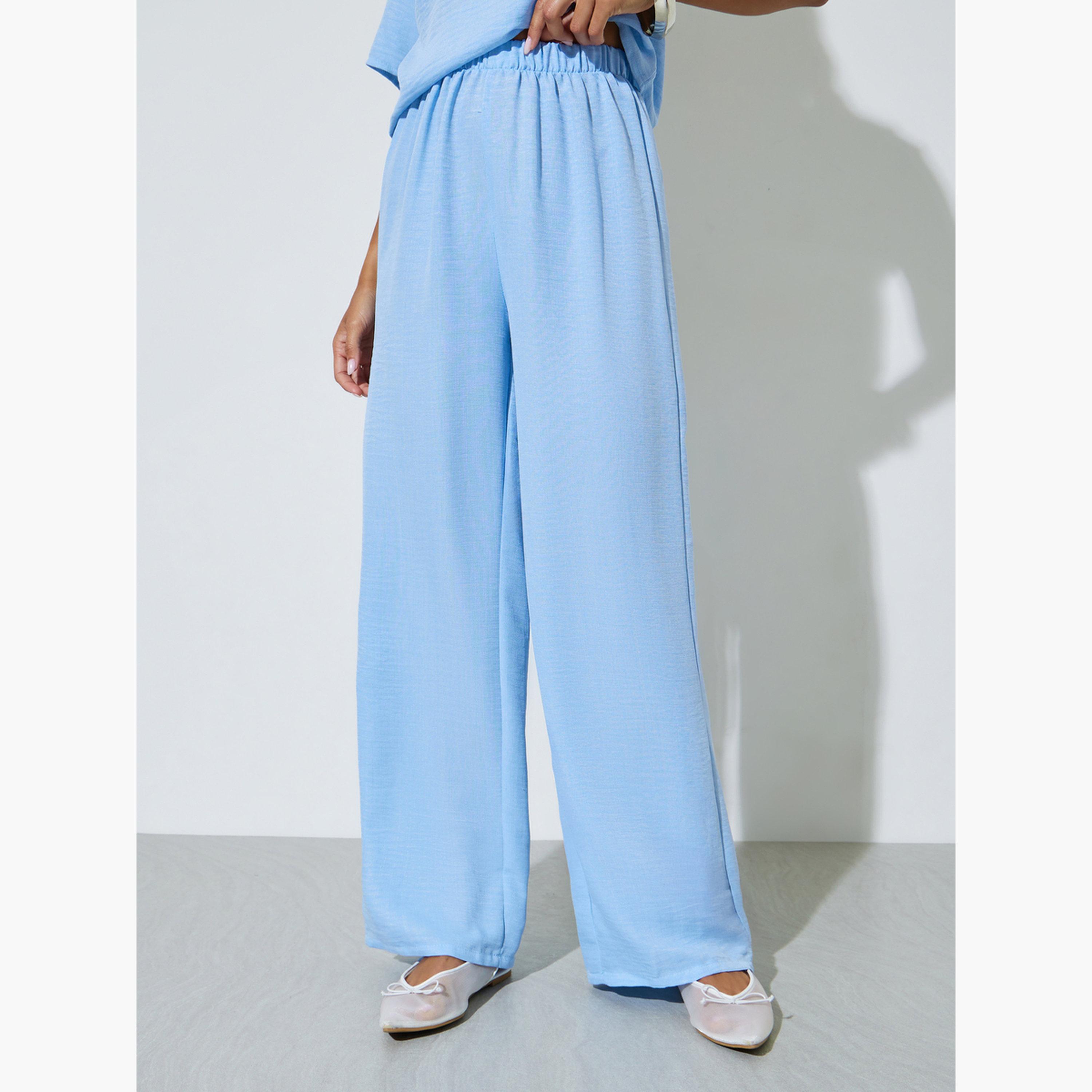 طقم منسق من بنطال بأرجل واسعة وبلوزة برباط عنق بلون سادة لون أزرق-women-clothing-coordsets-image-5