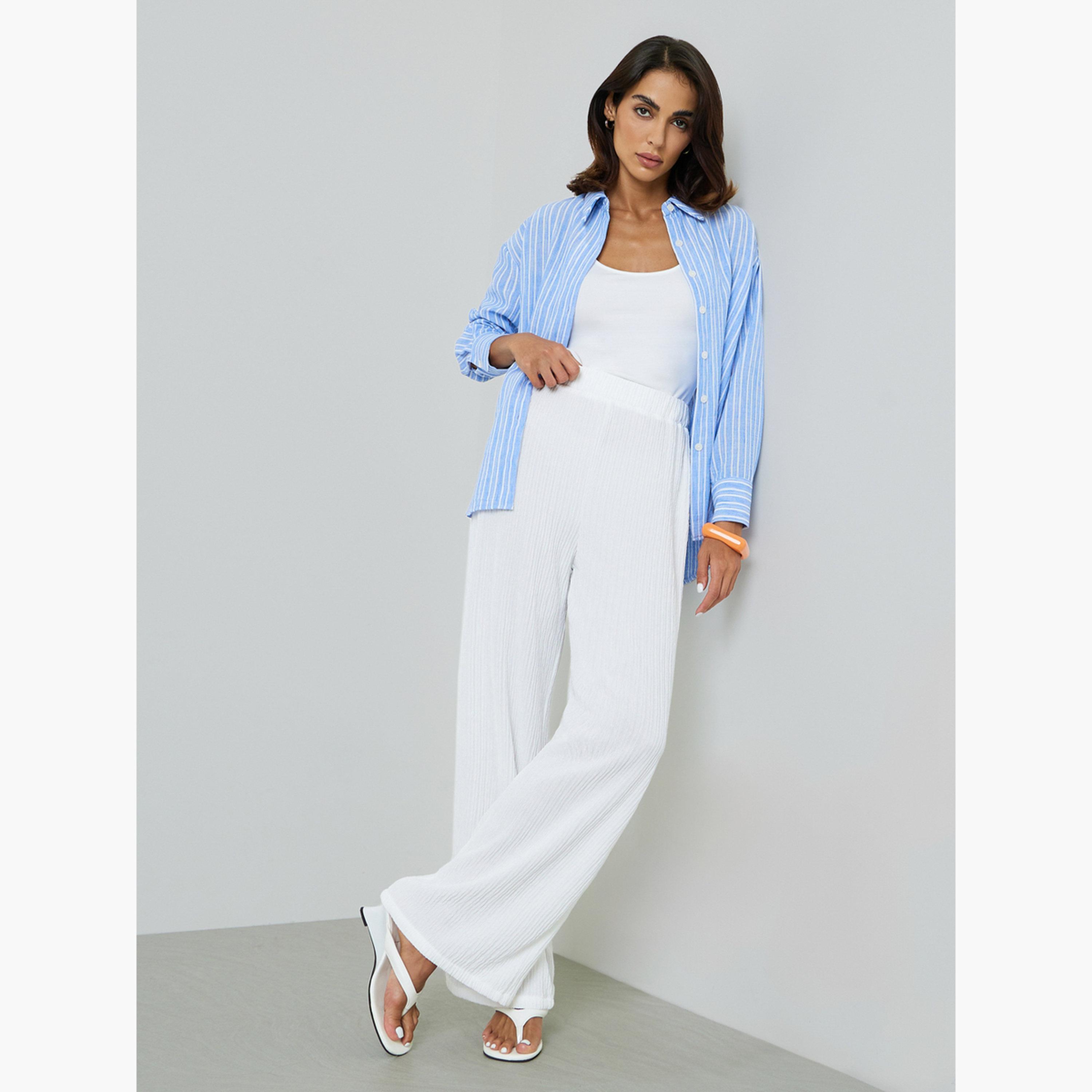 بنطال بتفاصيل بارزة الملمس وأرجل واسعة باللون الأبيض-women-clothing-joggers-image-2