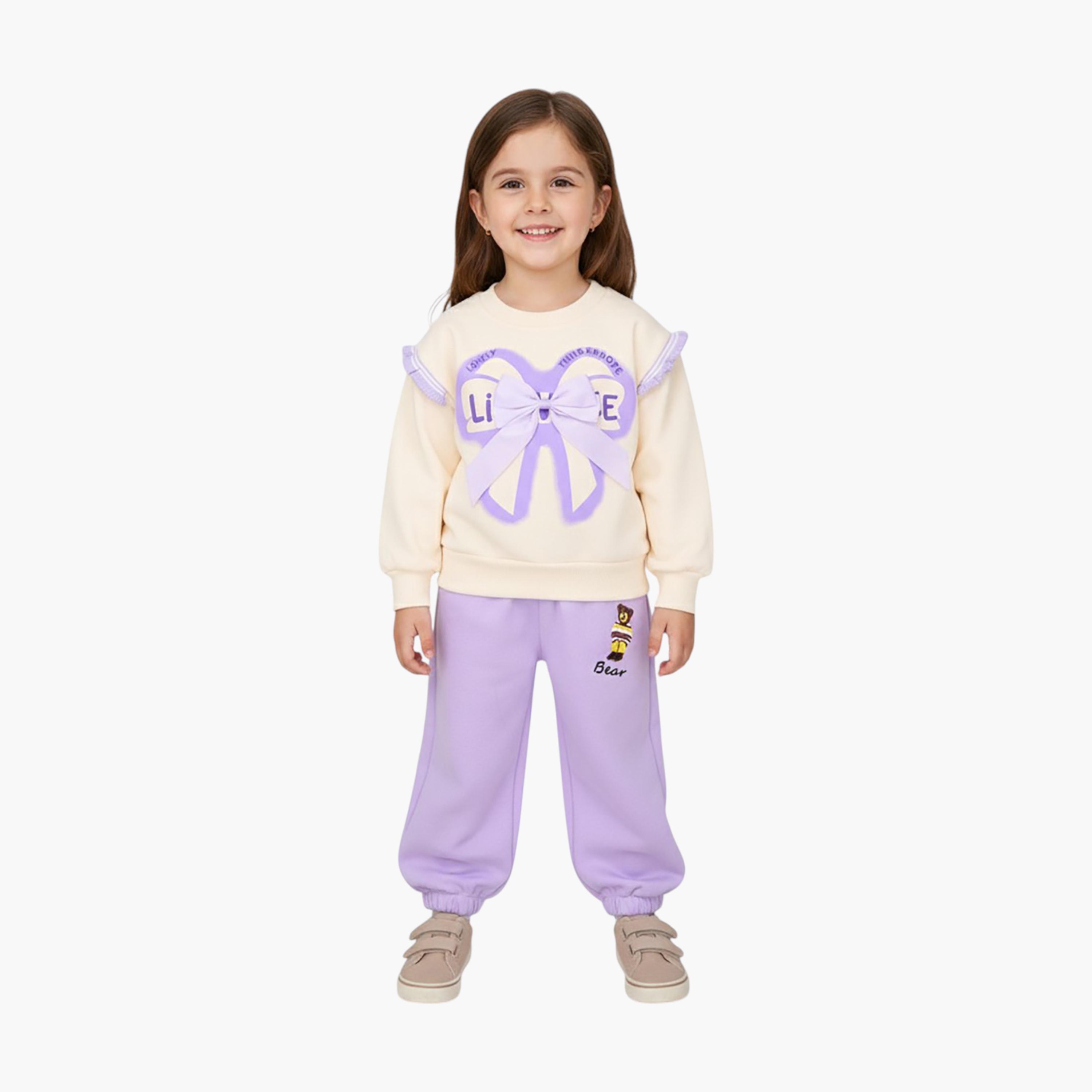 طقم من قطعتين: سويت شيرت مطبوع بتفاصيل فيونكة مع بنطال رياضي من بيبيكلو-girls-clothing-setsandcoords-image-1