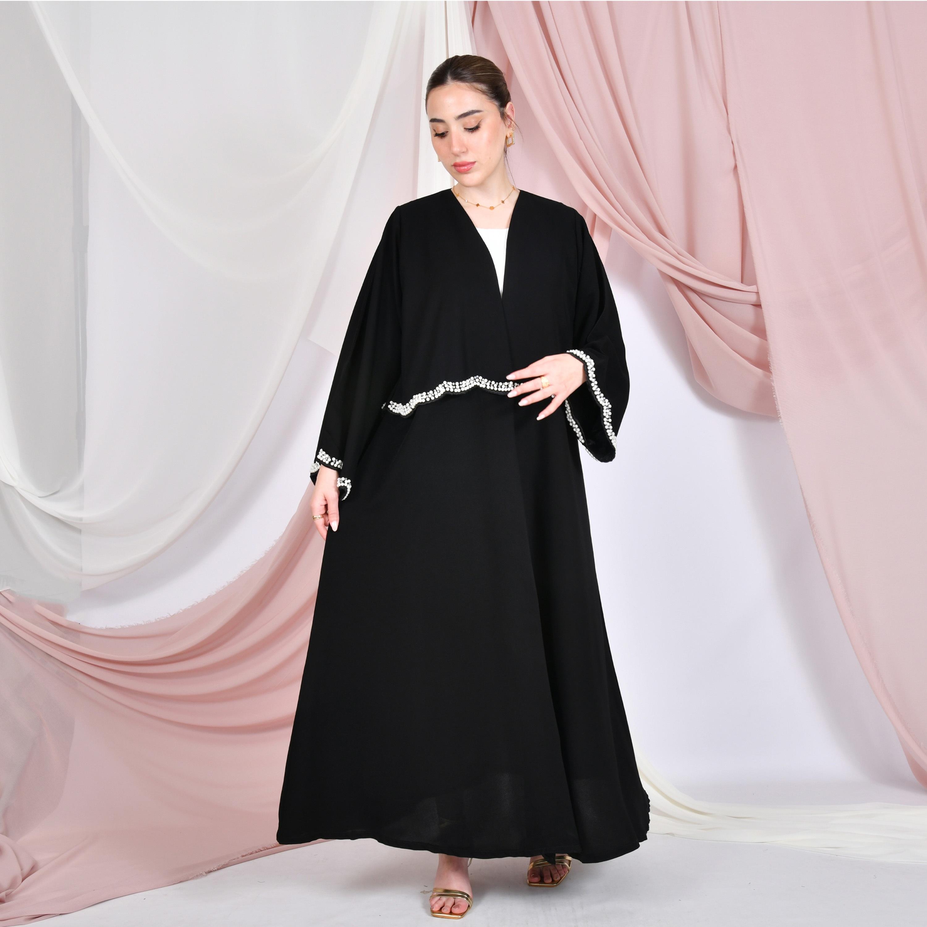 عباية نسائية كتان باللون الأسود بأكمام واسعة مزينة بتفاصيل لؤلؤية وتطريز على شكل صدف من حوراء.-women-arabicclothing-abayas-image-4