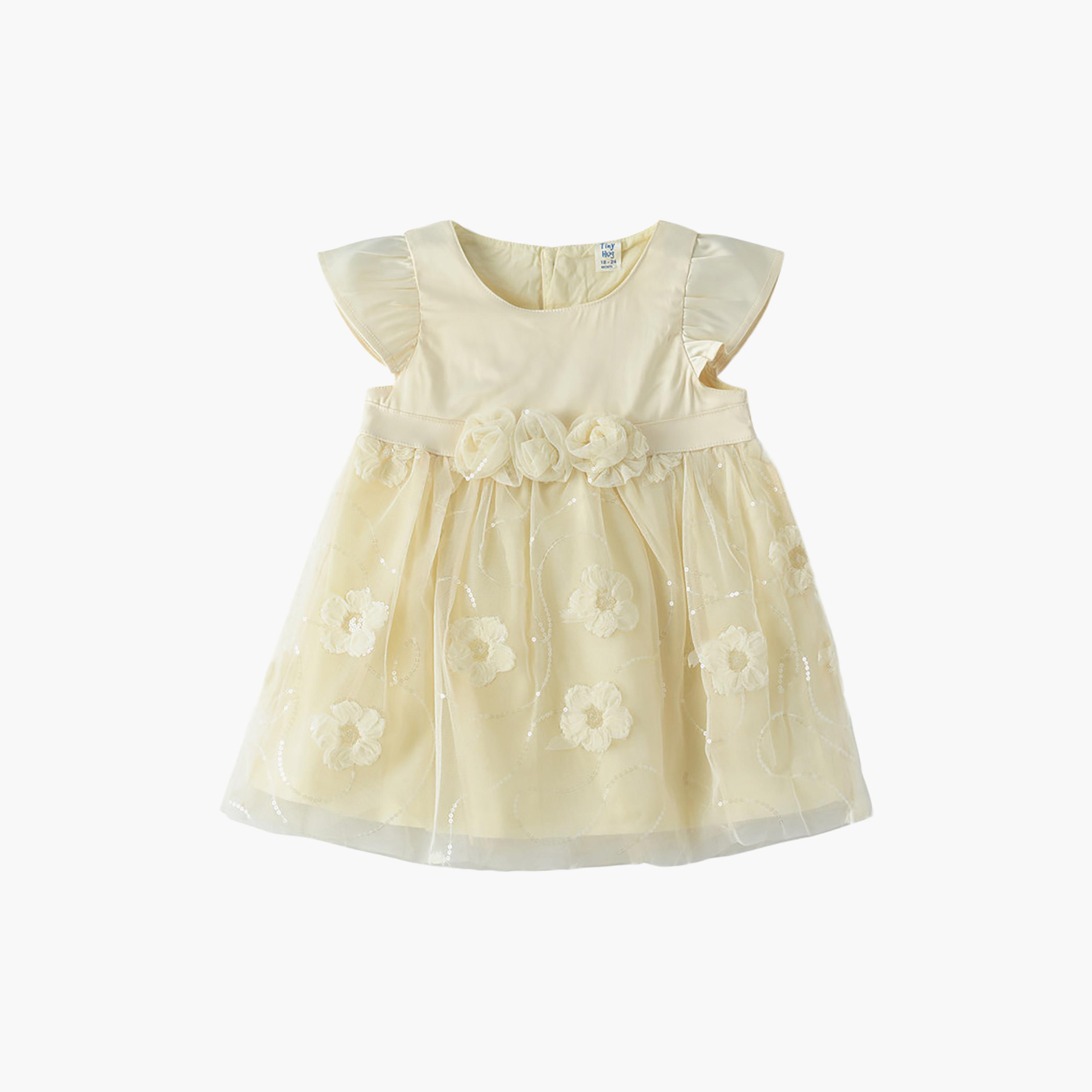 فستان قطن بأكمام قصيرة جداً (كاب) وبقوام بارز بنقشة زهور من يونيكيدز-baby-girls-clothing-dressesandjumpsuits-image-1