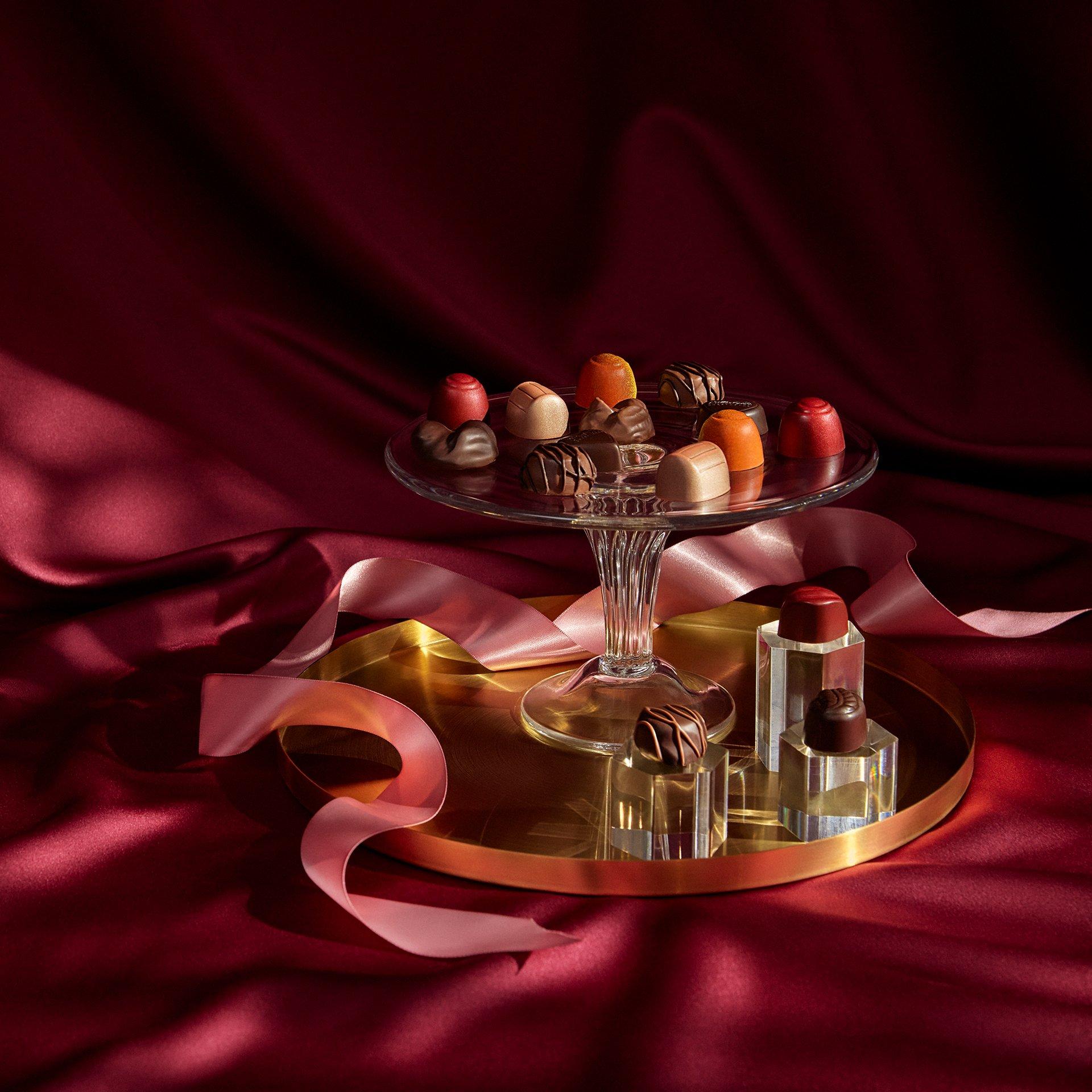 Assortment of Ethel M Chocolates' gems on tiered tray