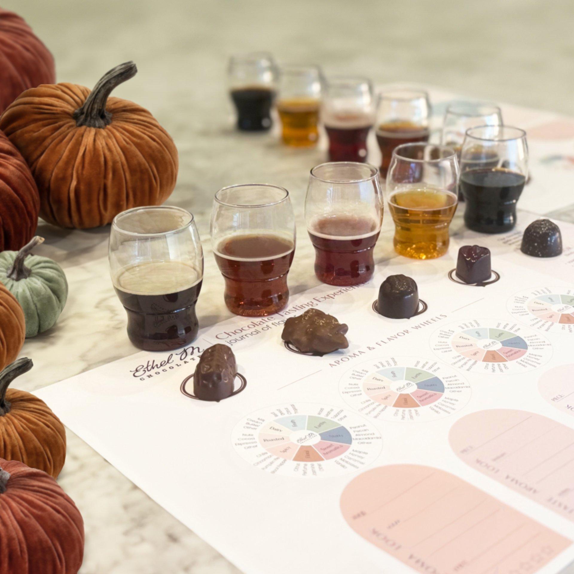 Five chocolate and beer pairings on a tasting mat with pumpkin decor