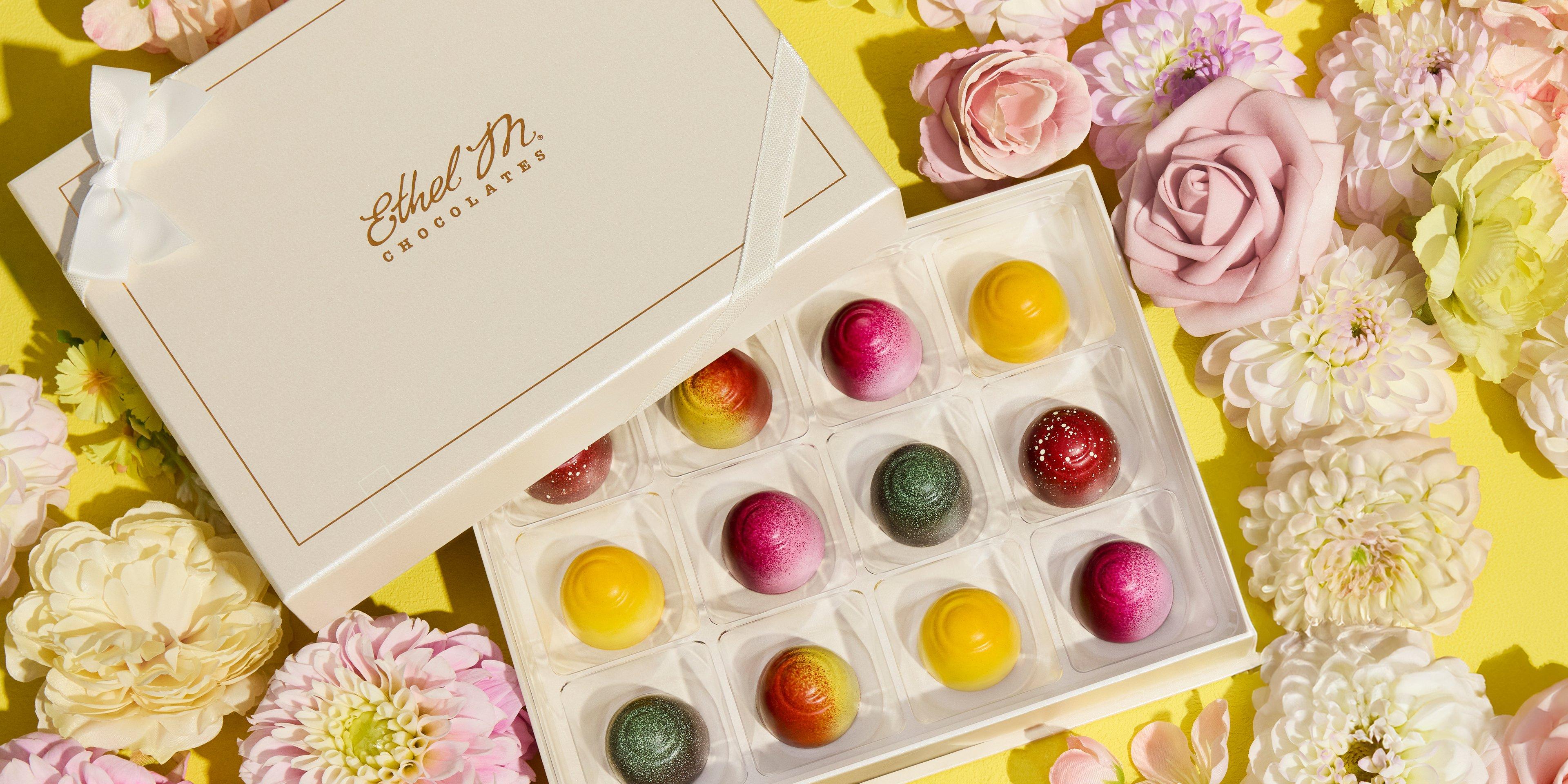 Cream 12 piece Custom Chocolate Box with Fruit Fusion truffles on yellow flower background