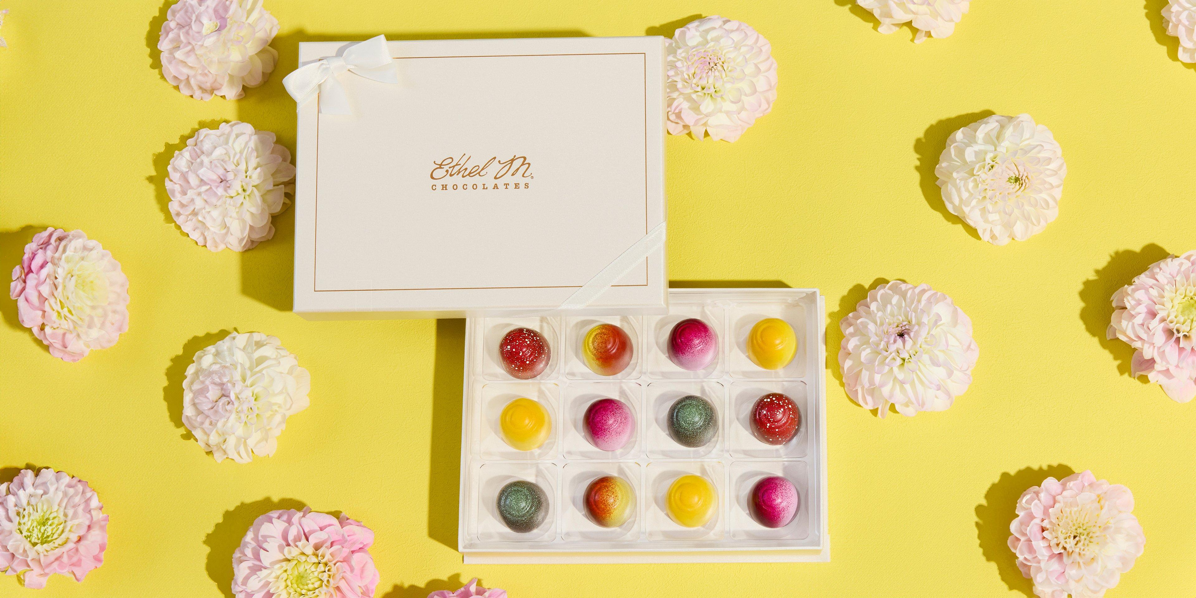 Cream 12 piece Custom Chocolate Box filled with Fruit Fusion Truffles on yellow background with flowers