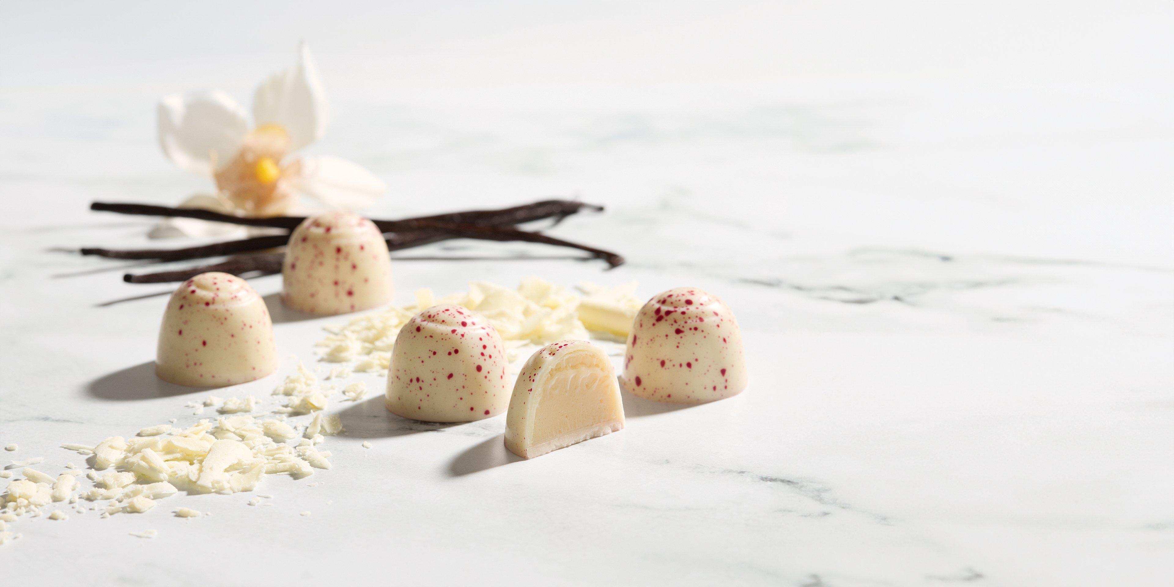 White Chocolate Vanilla Truffle on marble background with vanilla spices