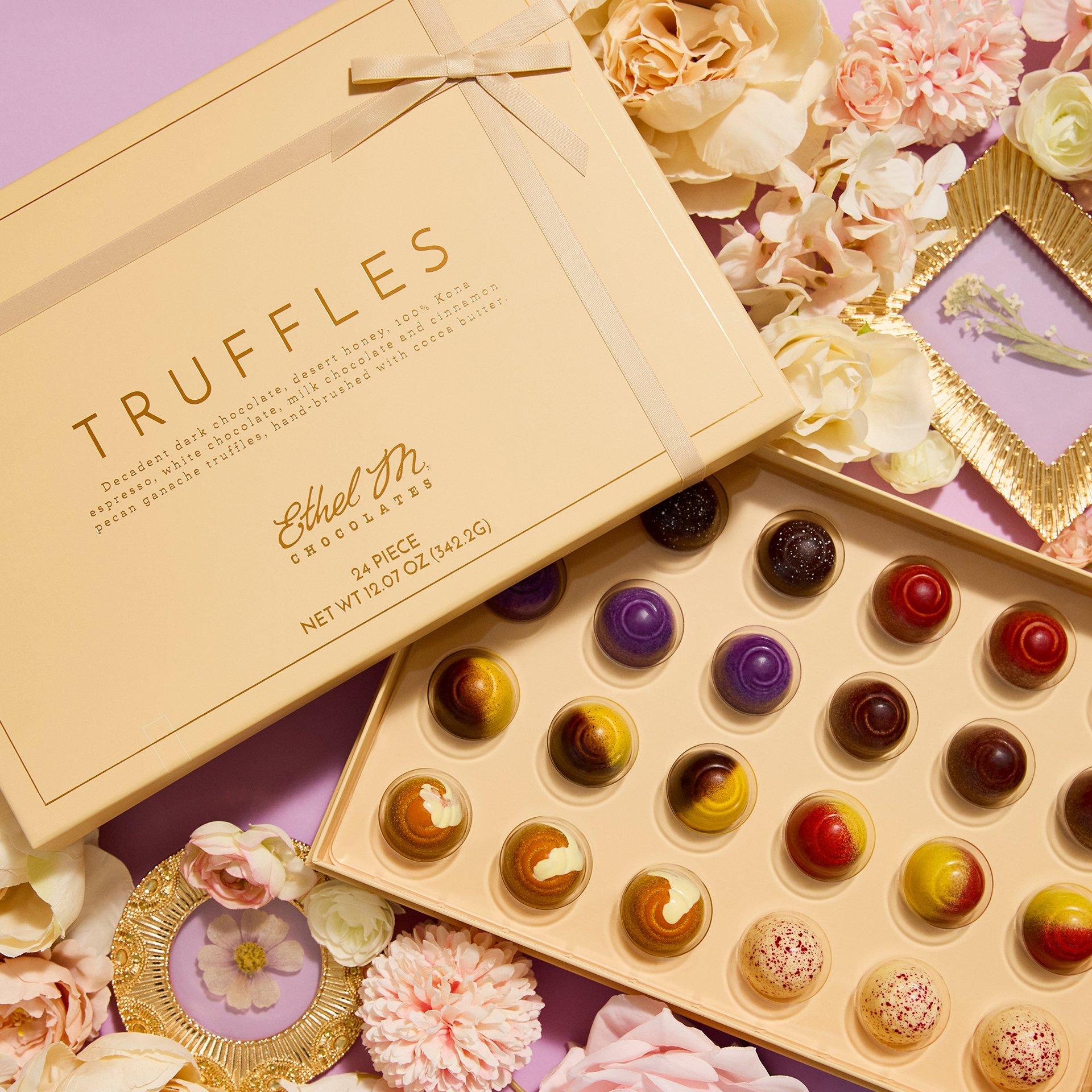 24 piece Truffles Collection opened on lavender background with flowers