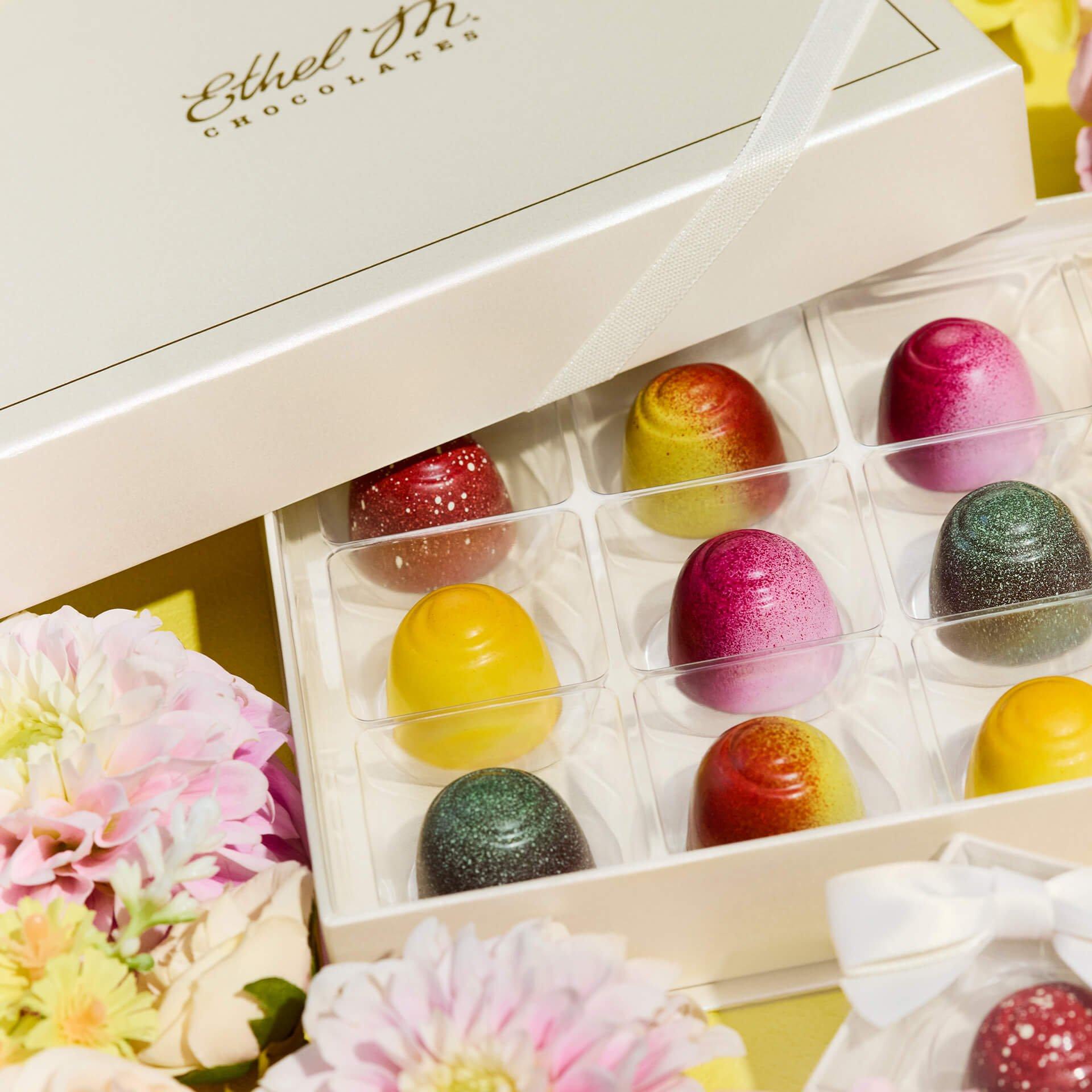 12 piece Fruit Fusion Custom Chocolate Box on yellow background with flowers 