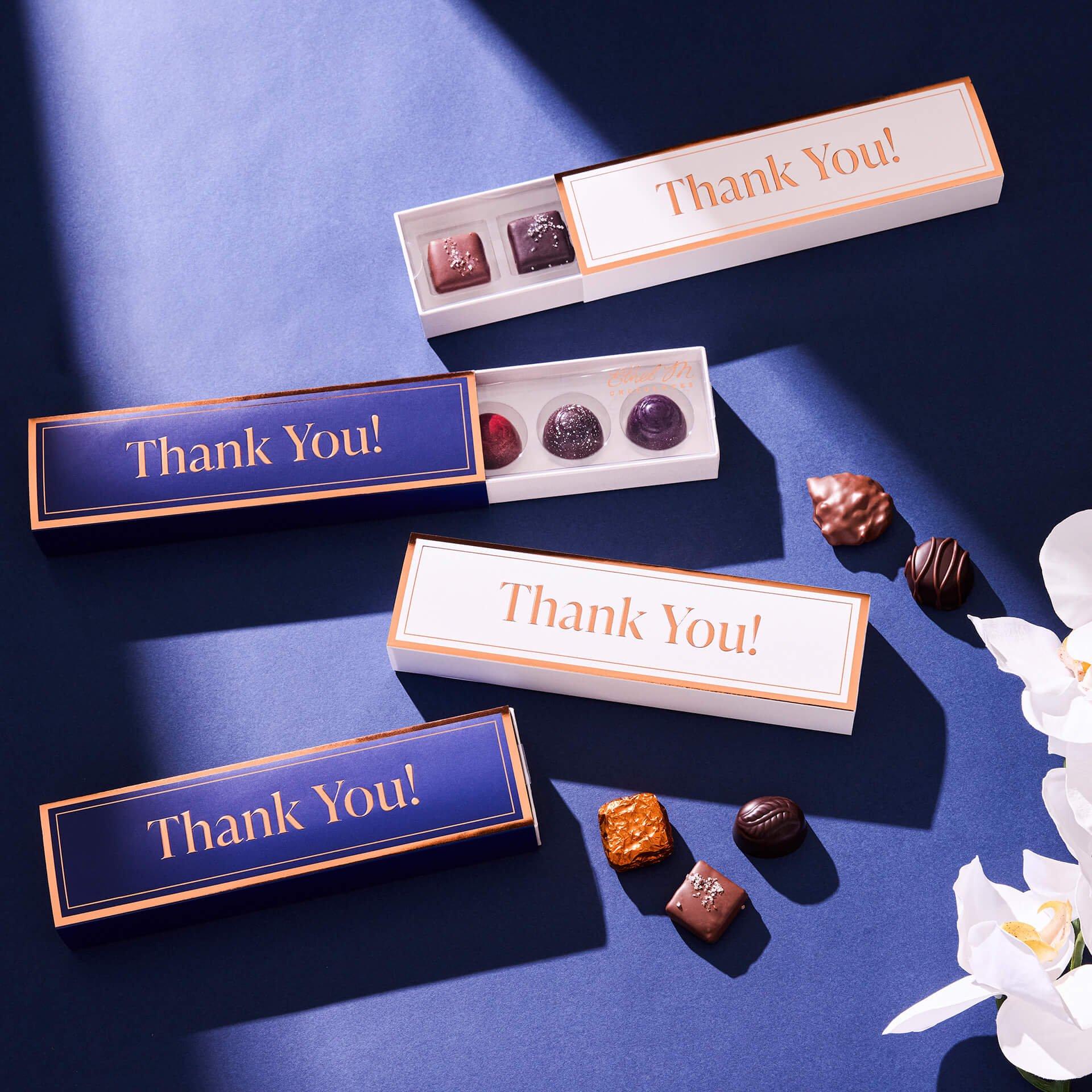 5 piece samplers with cream and sapphire Thank You Sleeves on sapphire background with white flowers