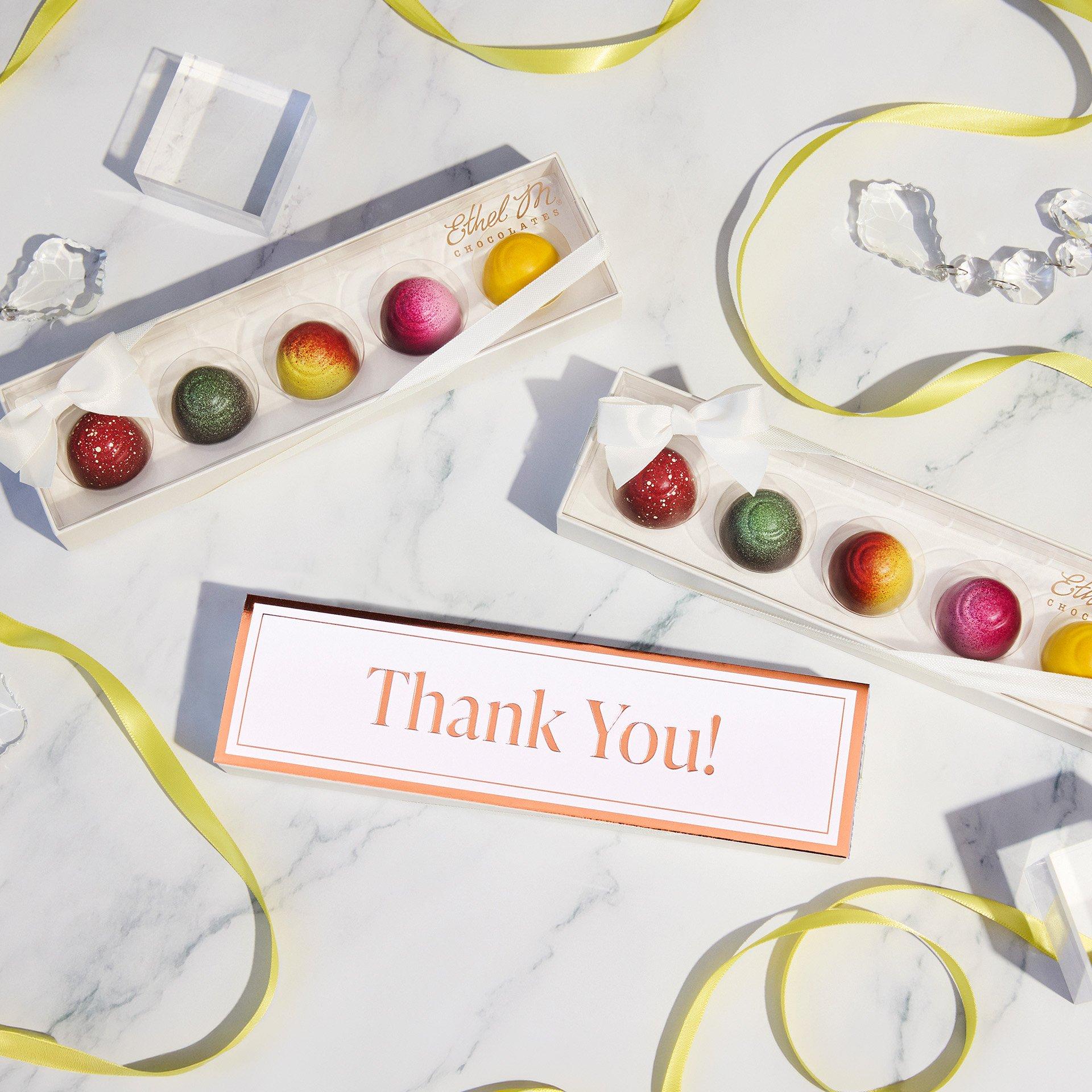 Fruit Fusion Sampler with Thank You Sleeve on white marble background with yellow ribbon