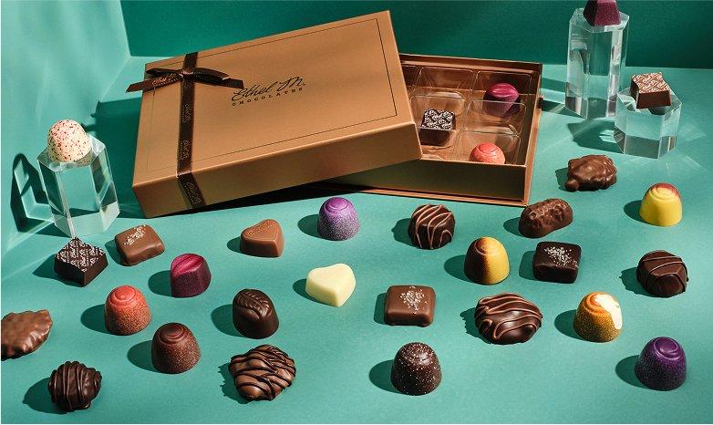 Ethel M Chocolates Custom Chocolate Box and pieces arranged on a table