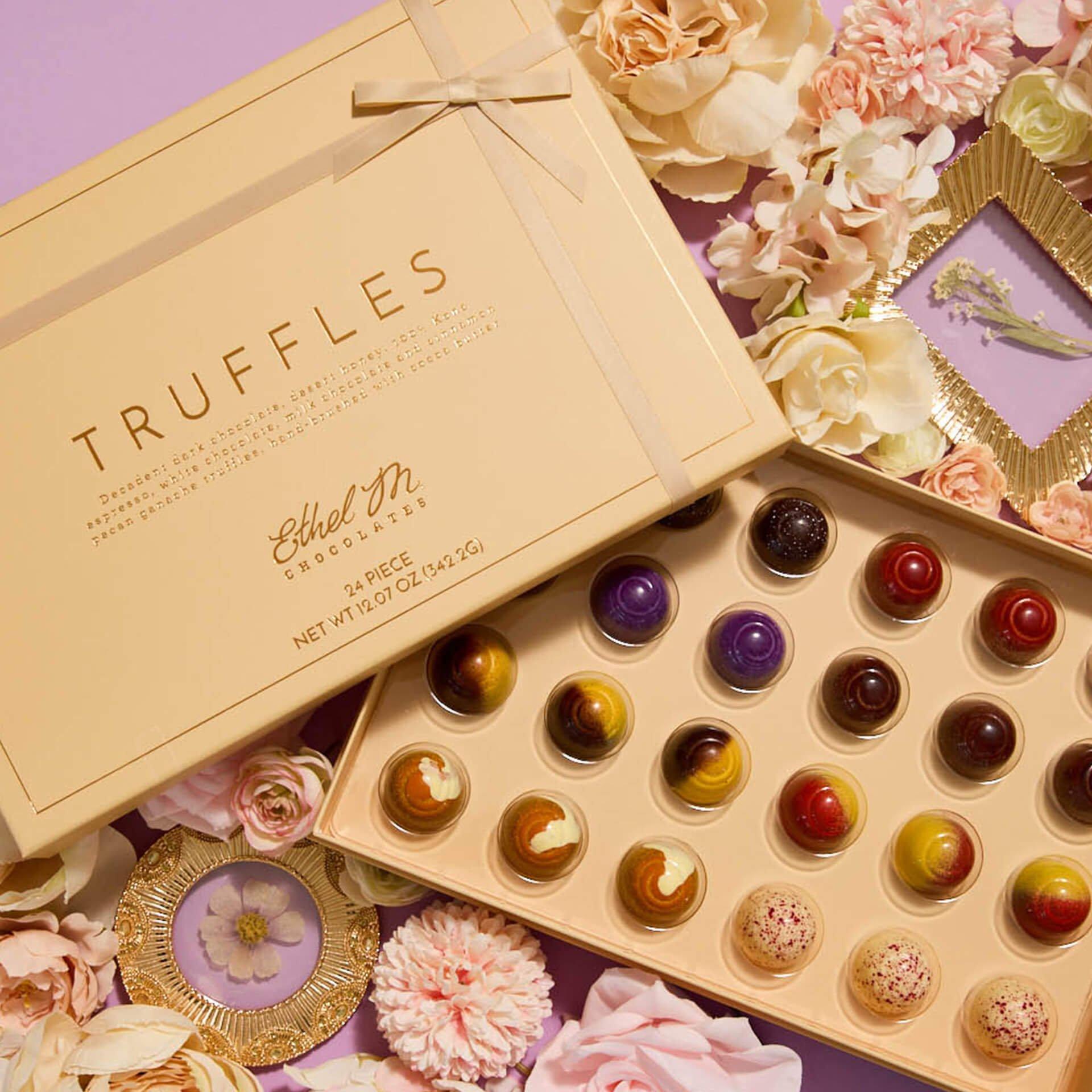 24 piece Truffles Collection opened on lavender background with flowers