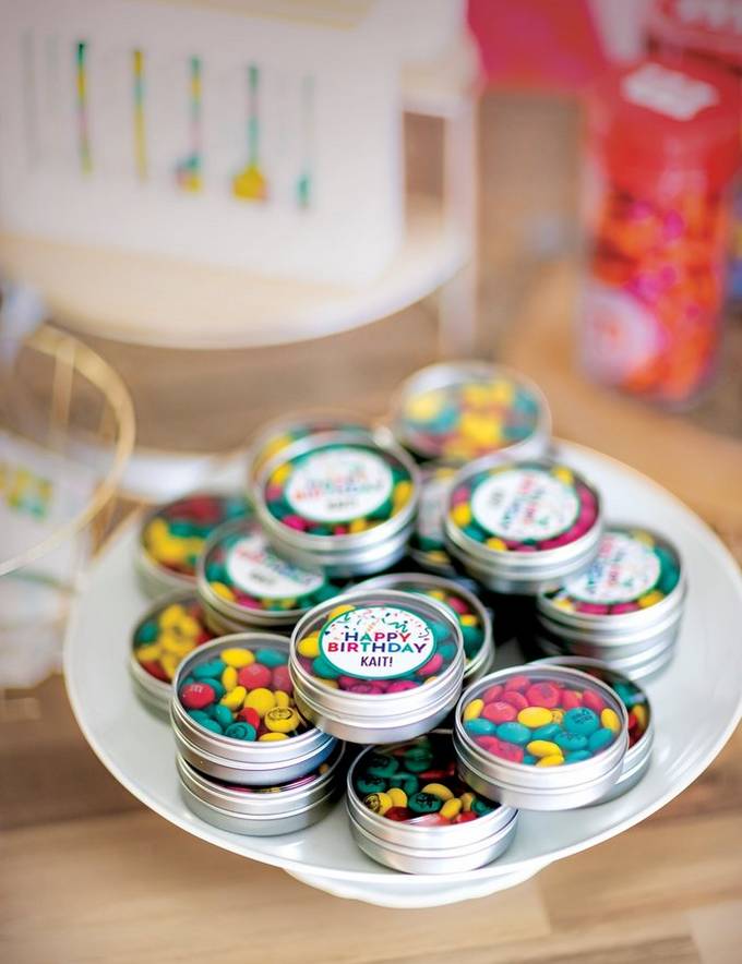 personalized M&M'S filled favor tins on display for birthday party