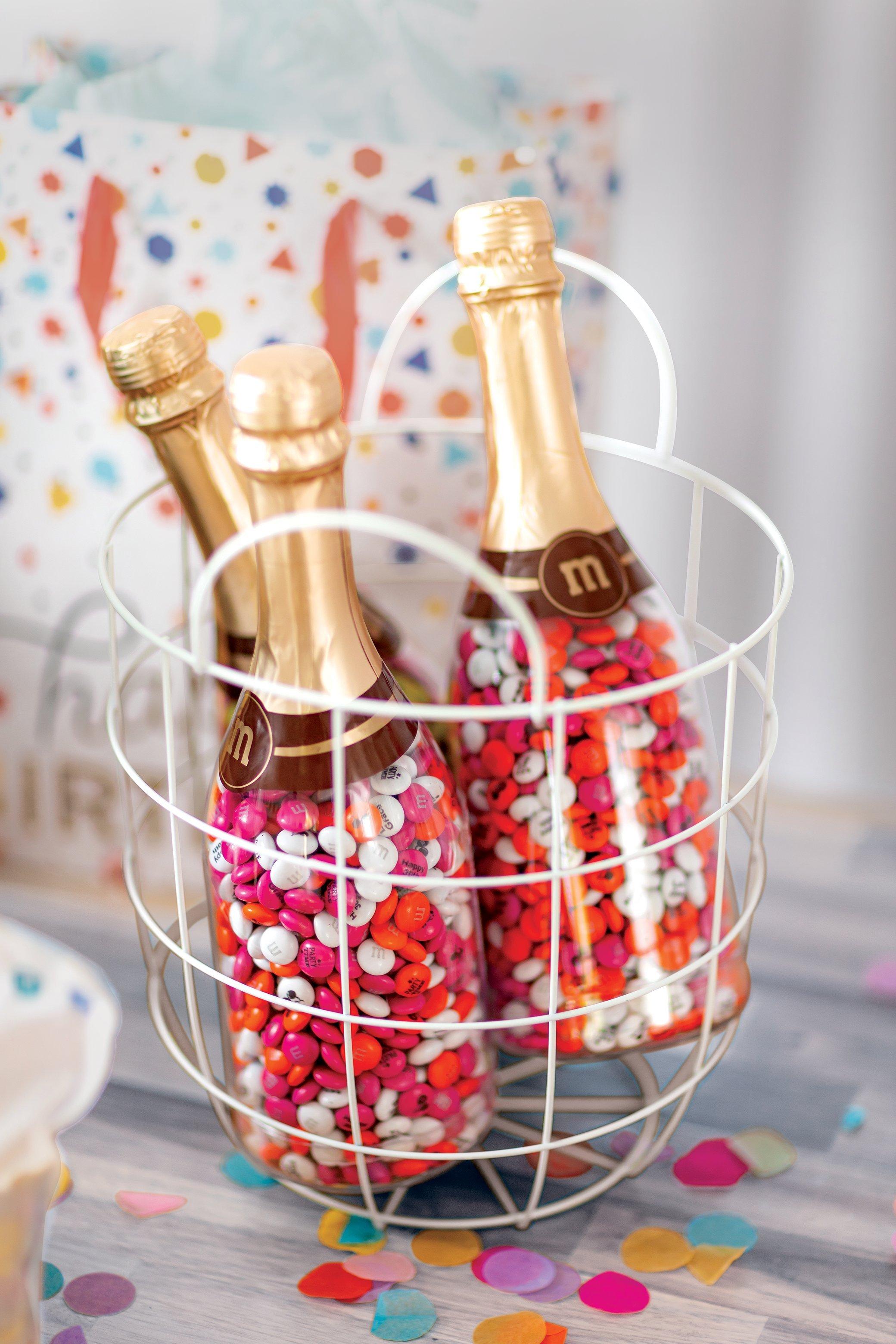 M&M'S filled occasion bottles in basket with birthday display