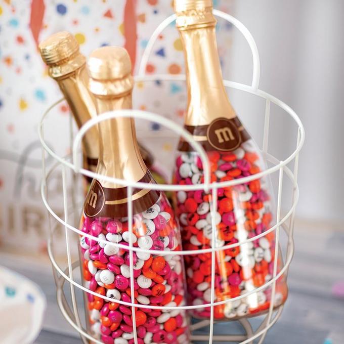 M&M'S filled occasion bottles in basket with birthday display