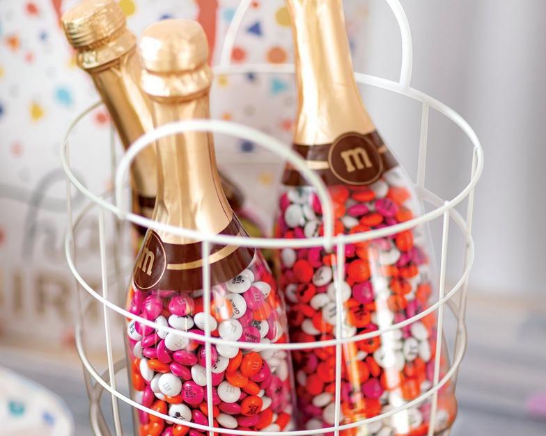 three occasion bottles in a basket