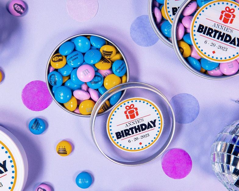 personalized birthday favor tins on table
