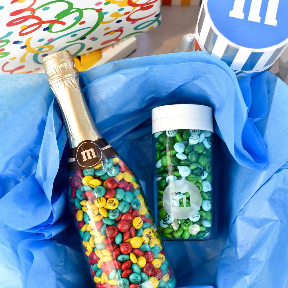 occasion bottle and gift jar surrounded by birthday presents
