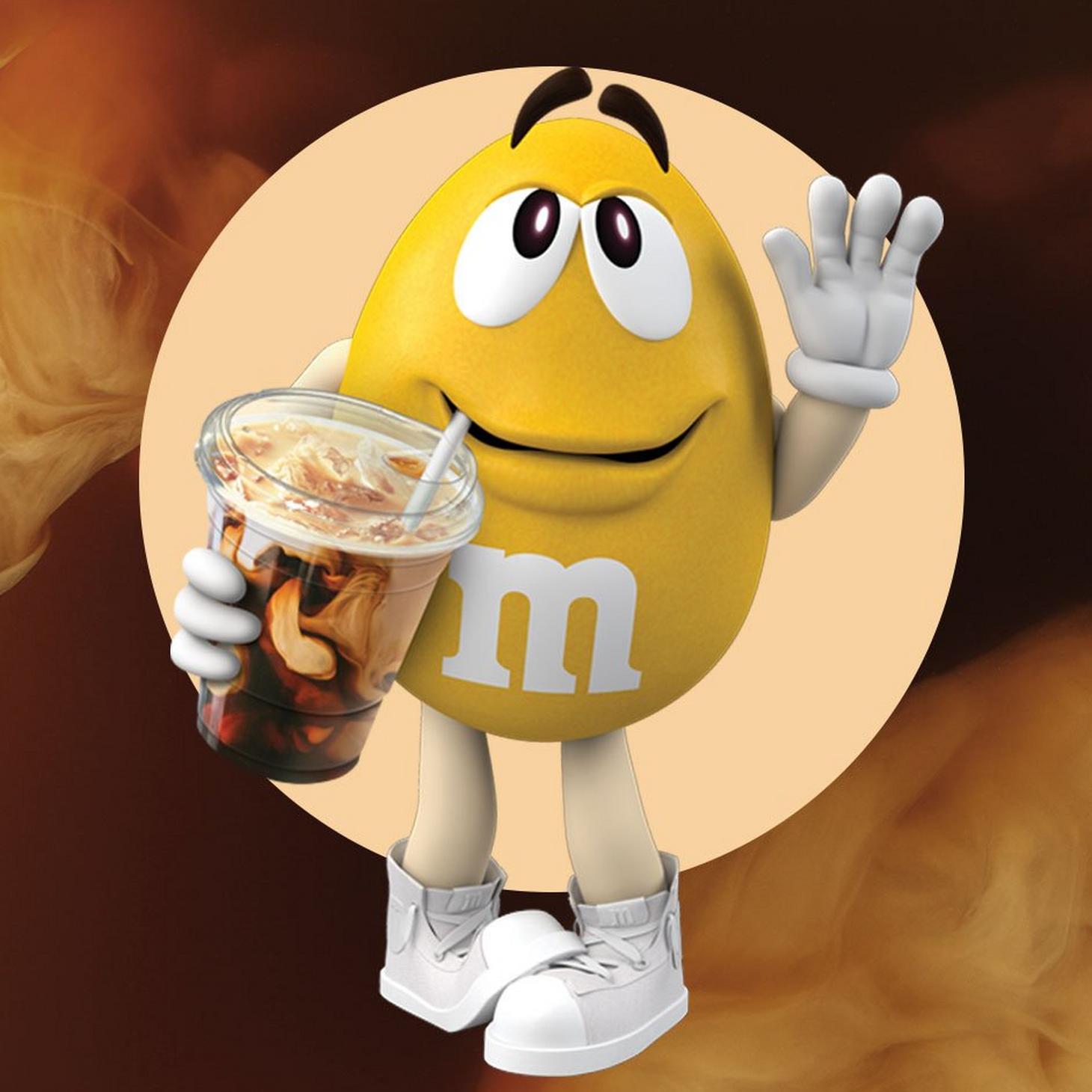 Yellow M&M'S Character holding Iced Coffee