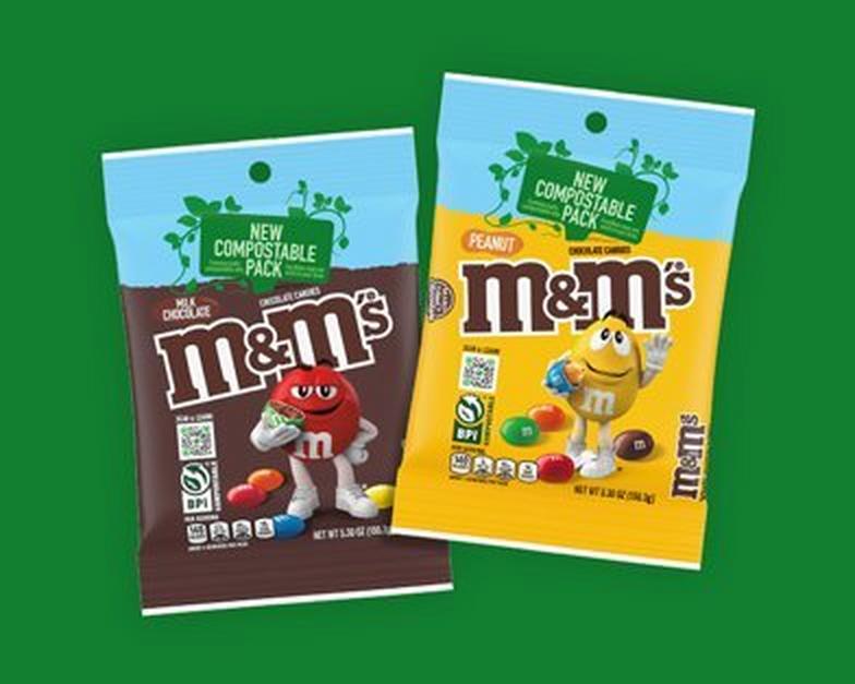 two compostable packs on green background