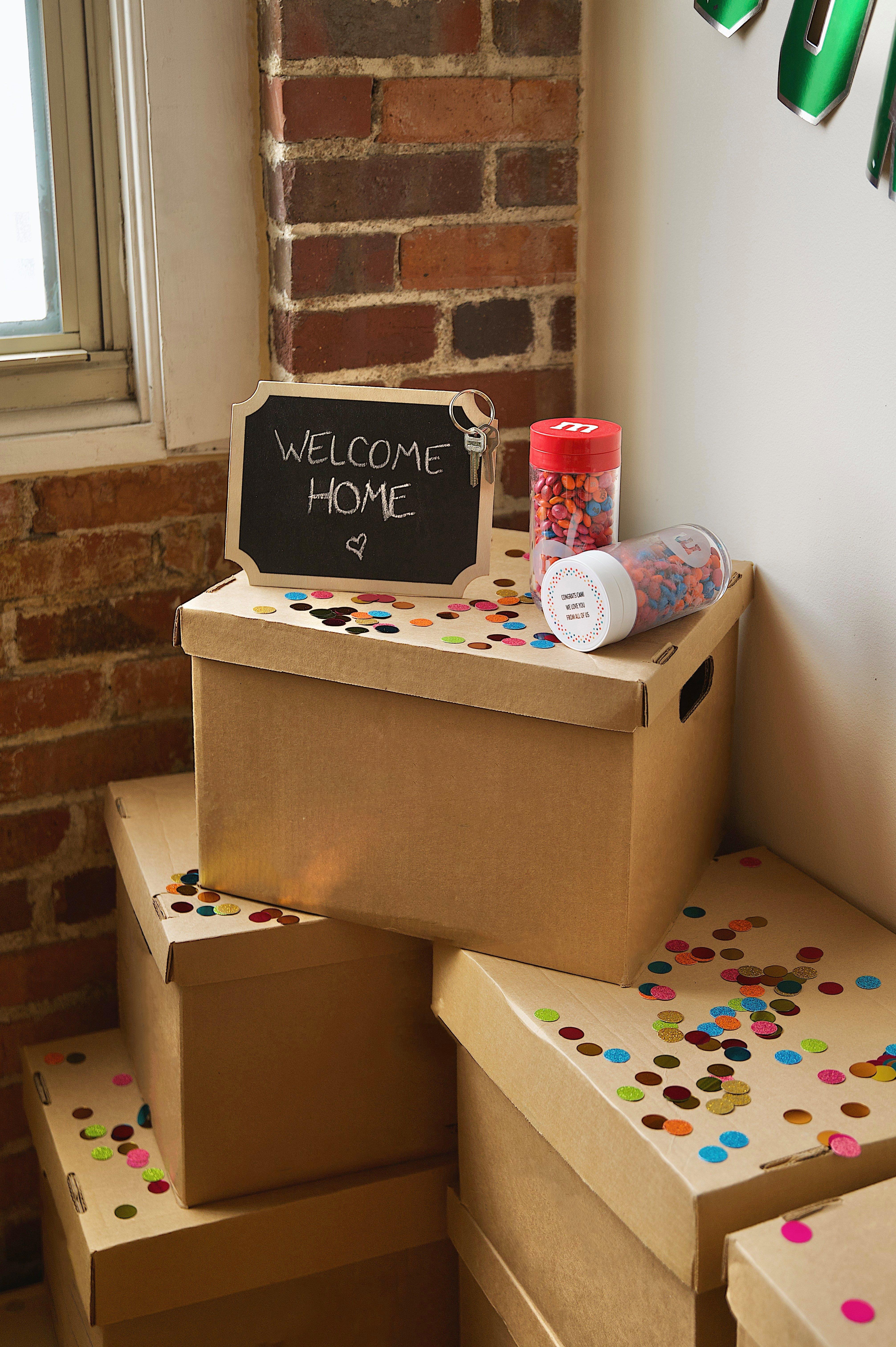 friends gathering around a table celebrating and gift giving