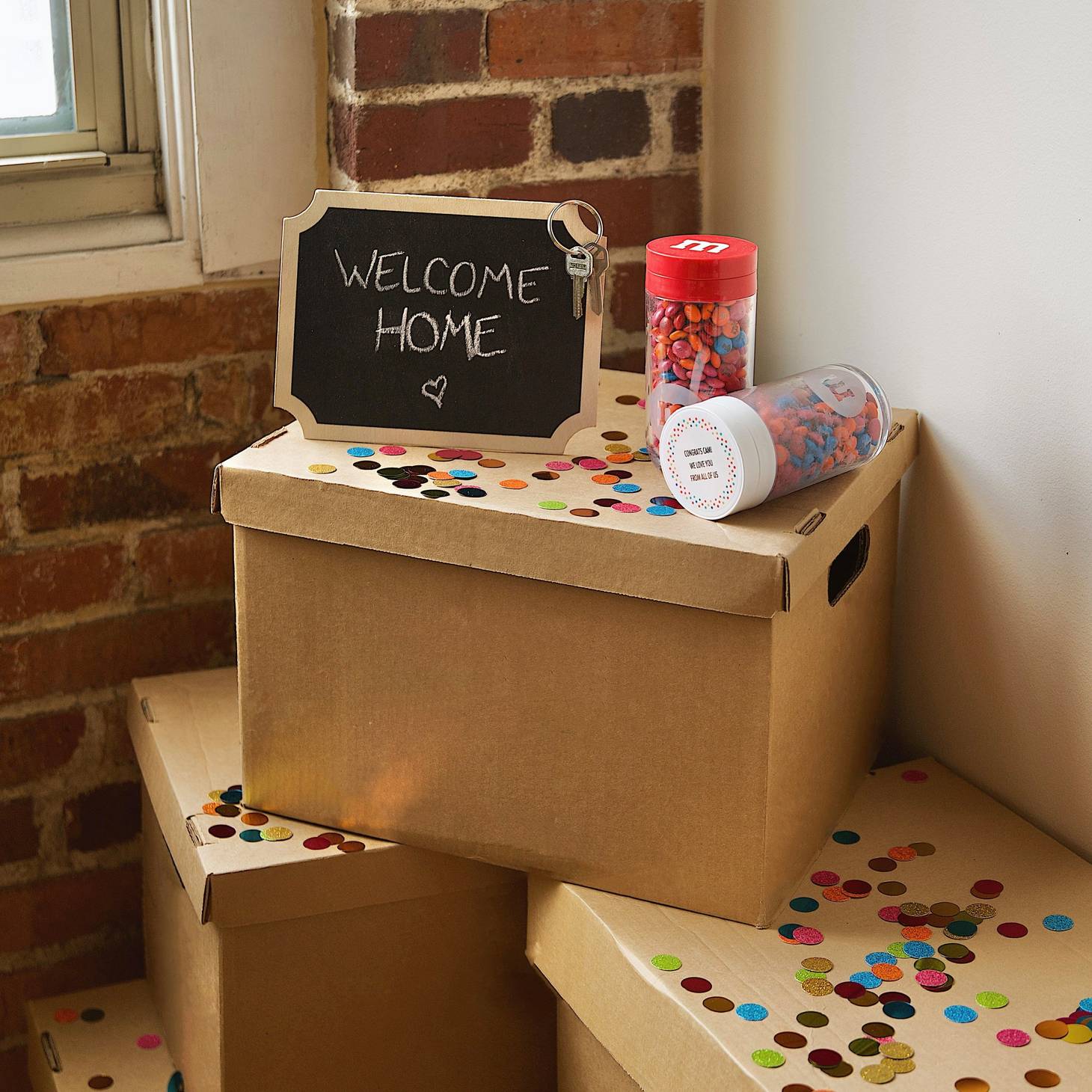friends gathering around a table celebrating and gift giving