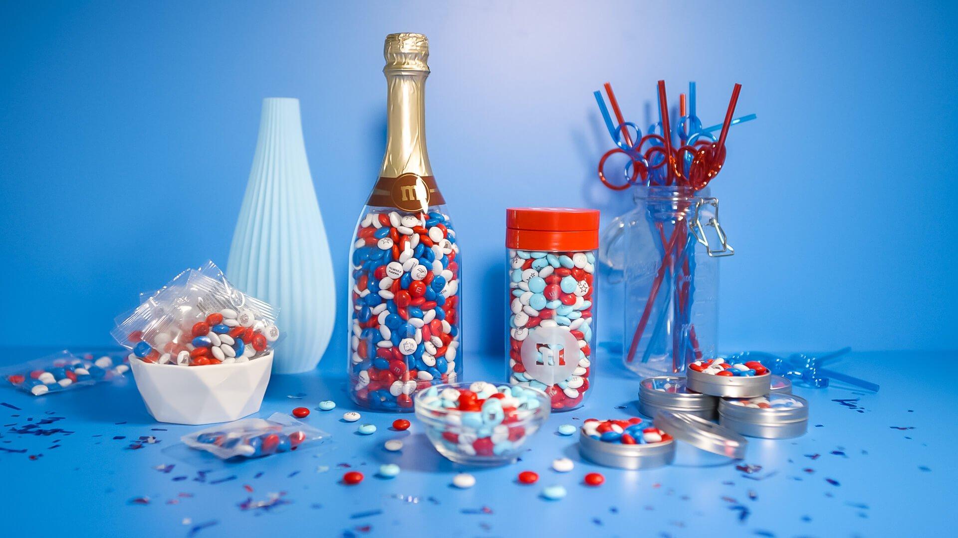 assorted M&M'S in different containers in patriotic colors