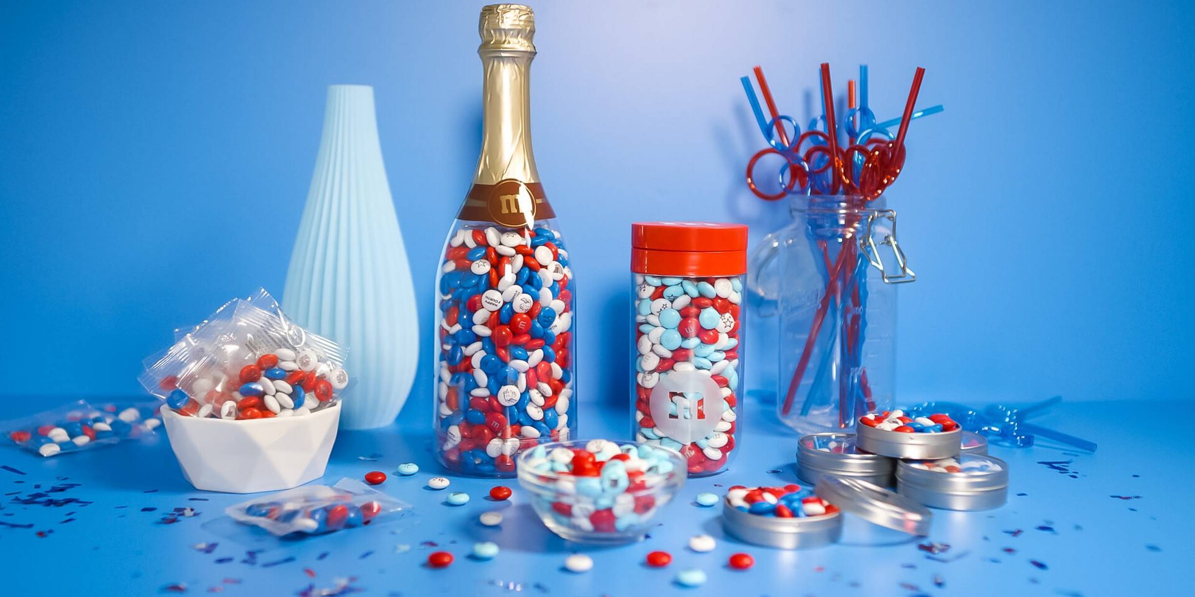assorted M&M'S in different containers in patriotic colors