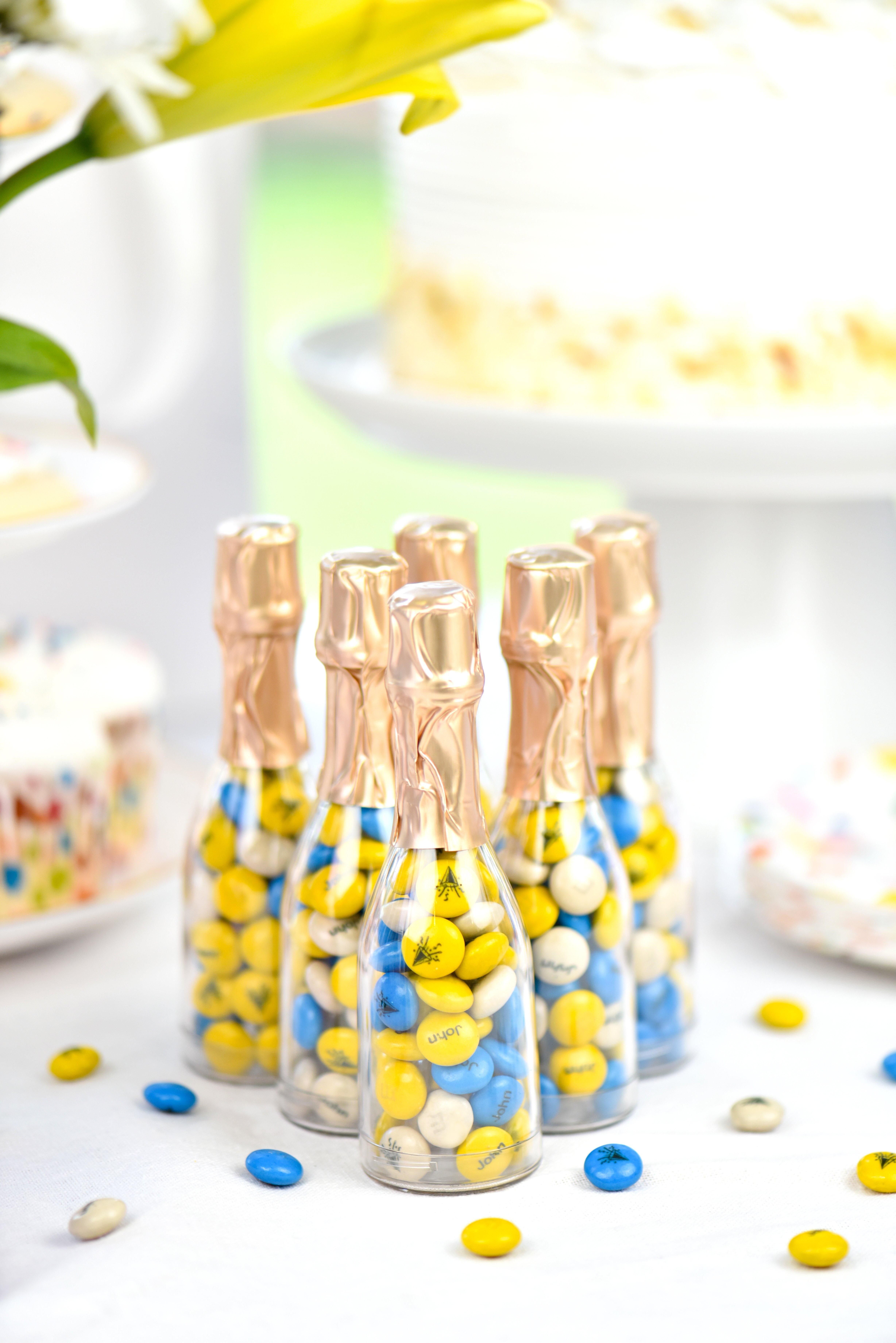 mini bottles on dessert table