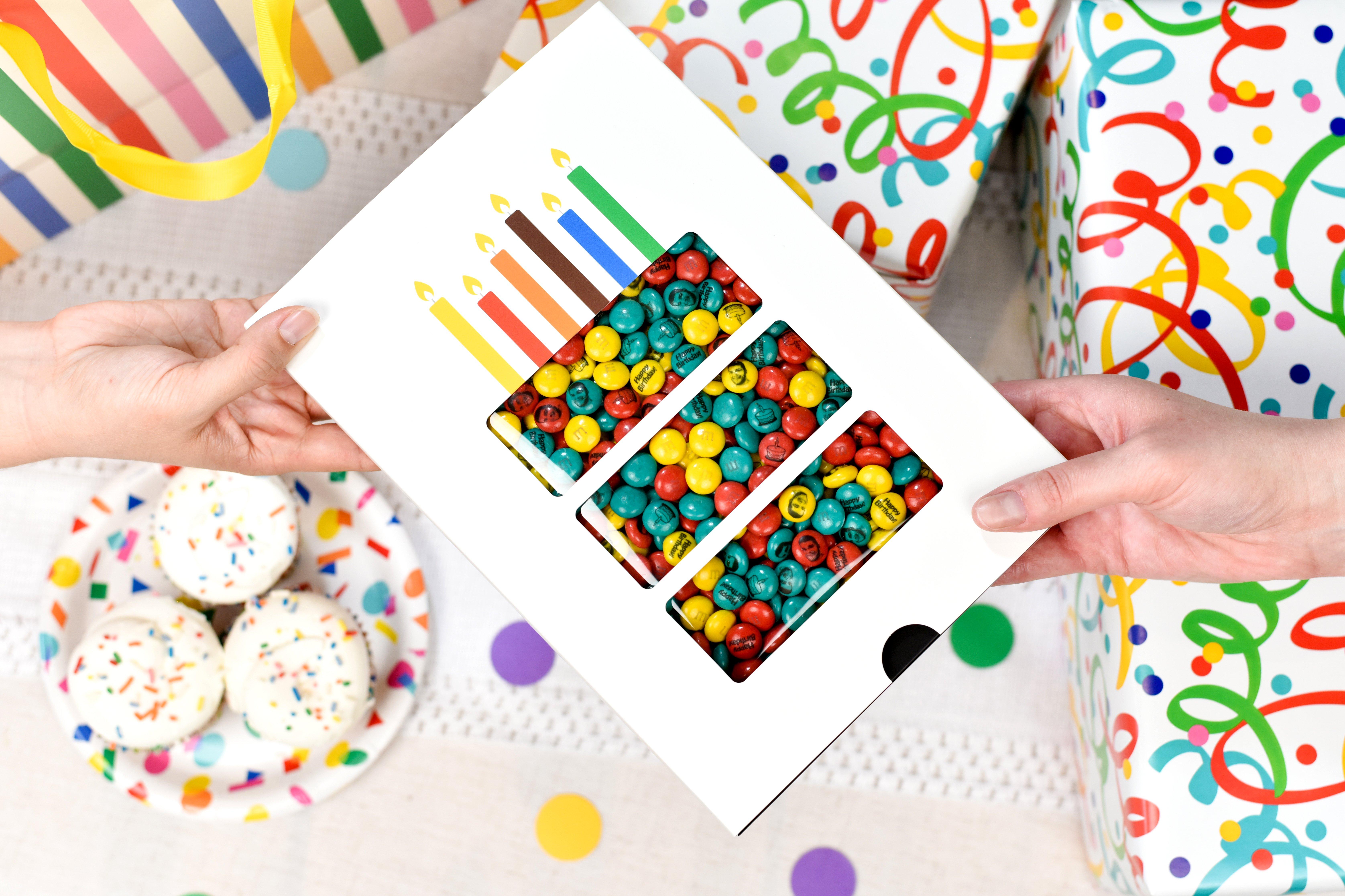 one person gifting a birthday box to another