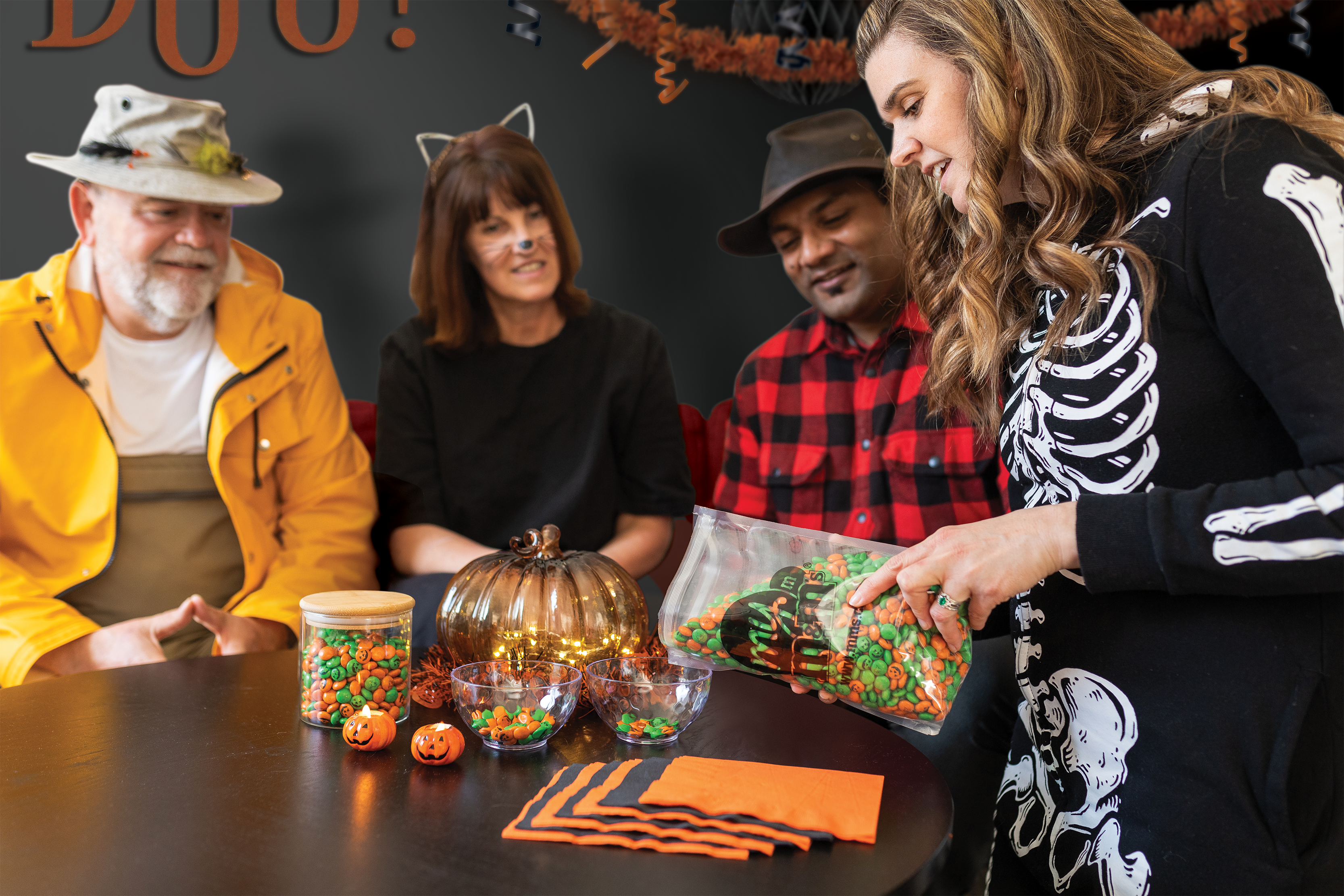 a family celebrating Halloween with M&M'S