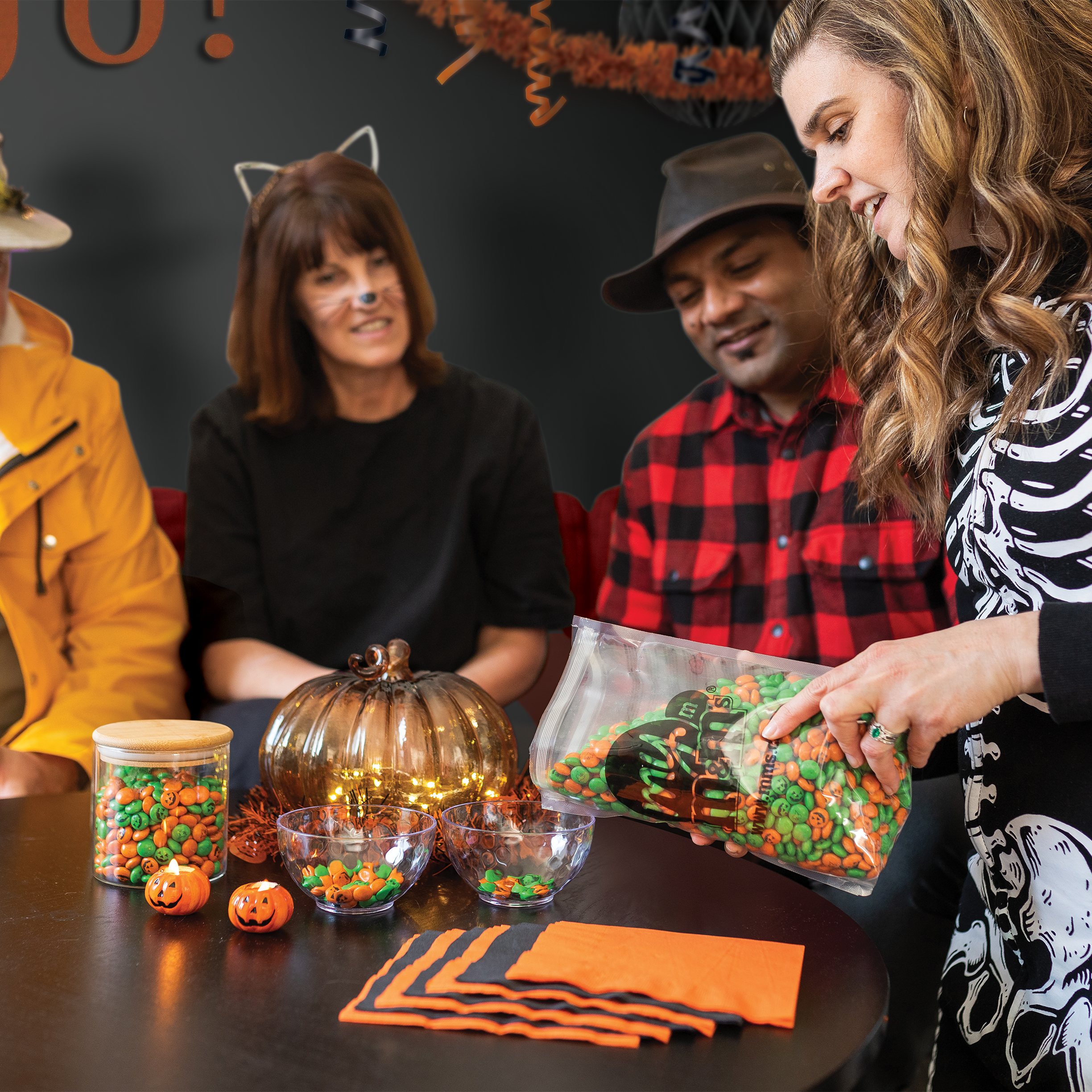 a family celebrating Halloween with M&M'S