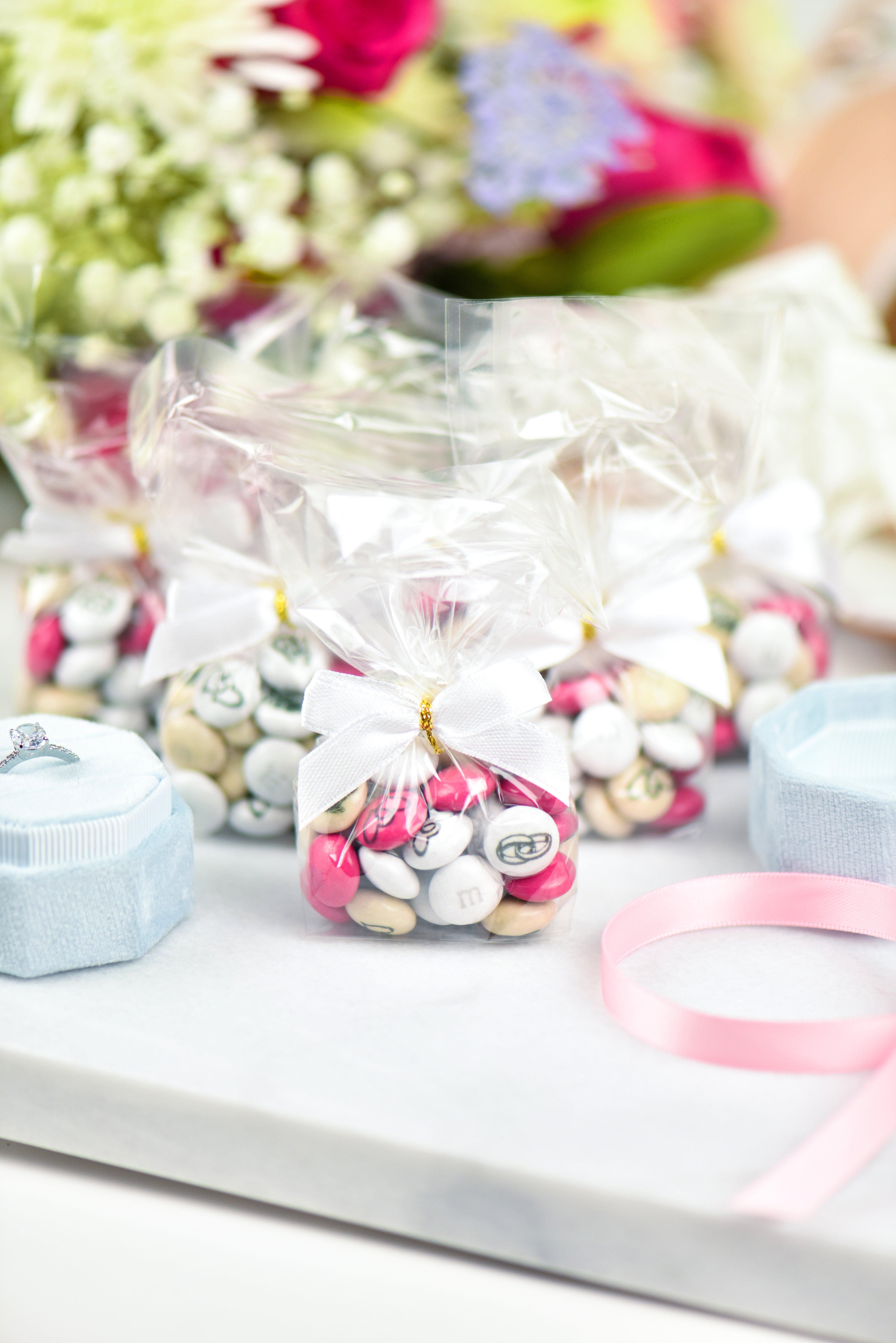 small bags filled with personalised M&M'S on table